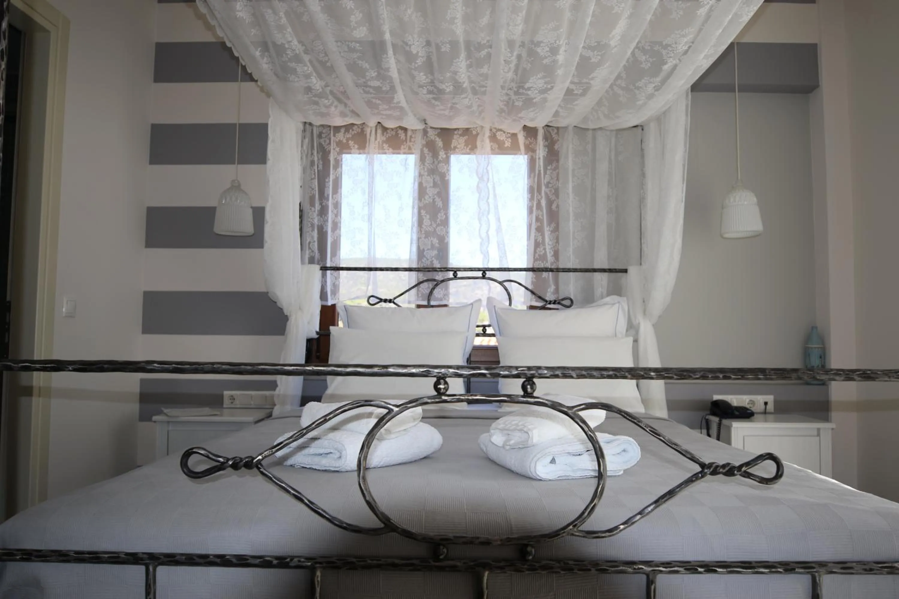 Bed in Dimitra Boutique Hotel