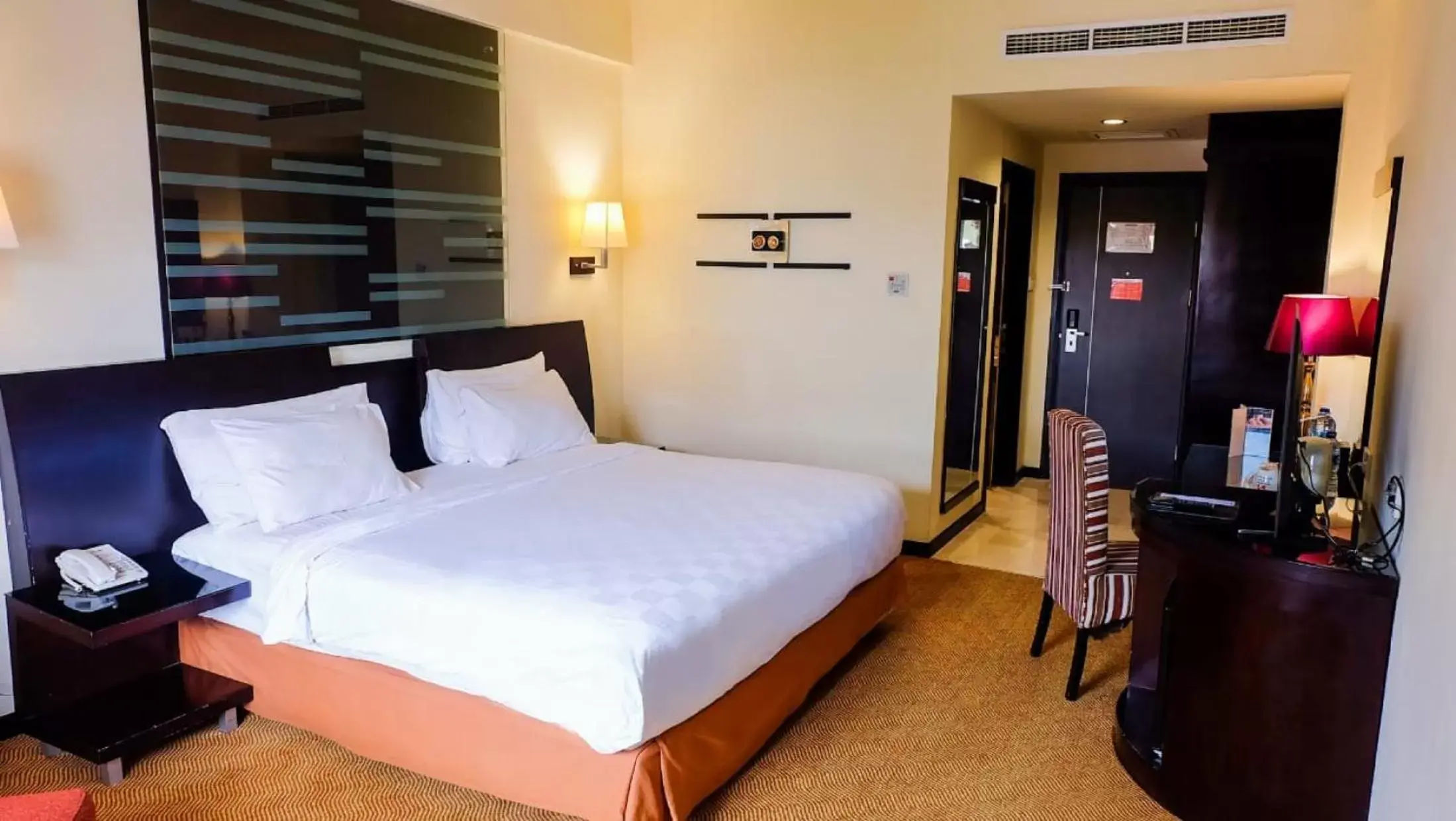 Bed in Swiss-Belhotel Silae Palu