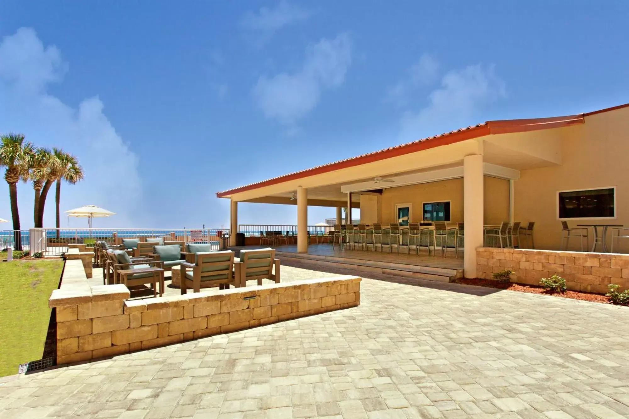 Patio, Swimming Pool in Holiday Inn Hotel & Suites Daytona Beach On The Ocean, an IHG Hotel