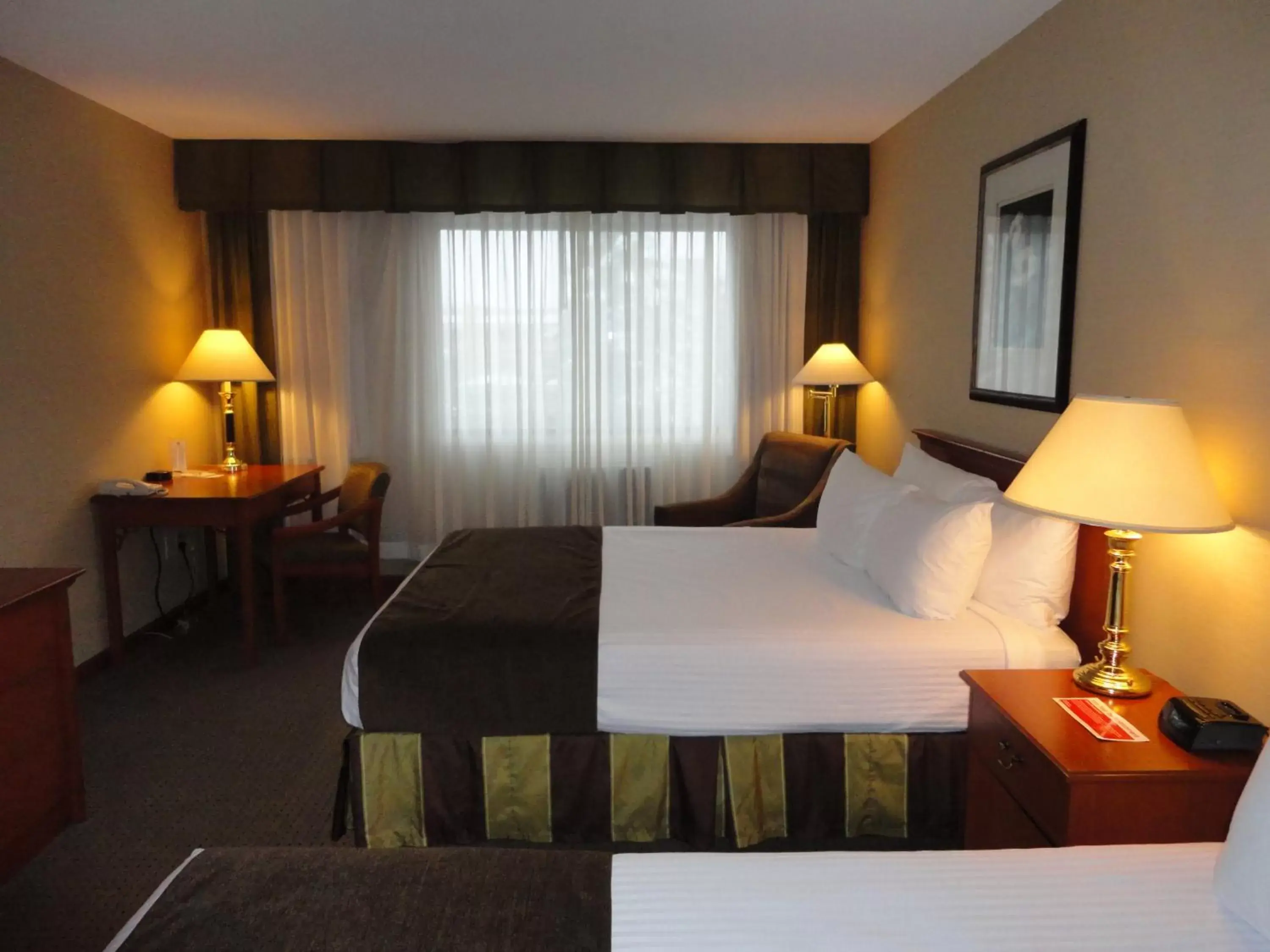 Bed in Ramada by Wyndham Kelowna Hotel & Conference Center