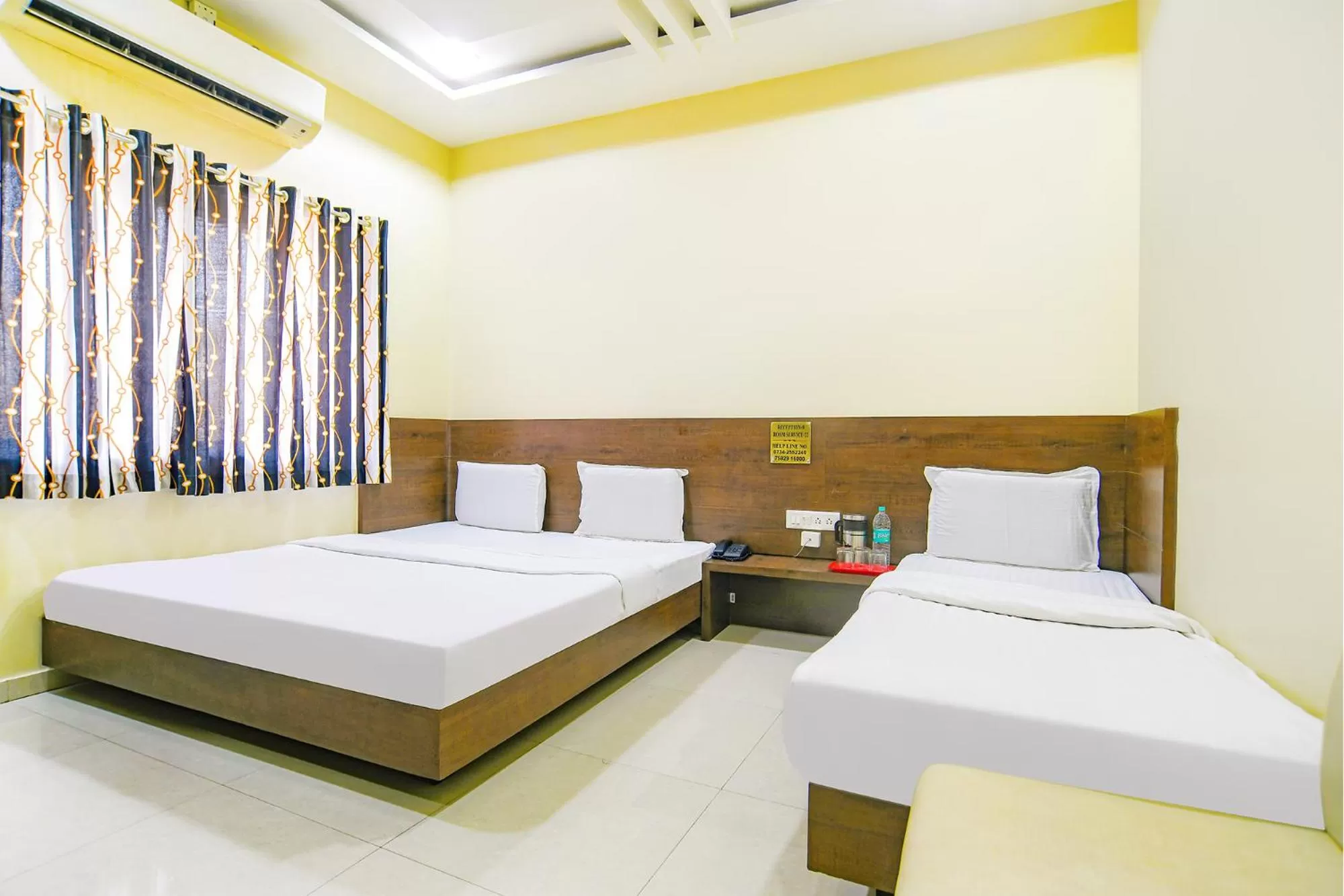 Bed in FabHotel Satyug Jaisinghpura