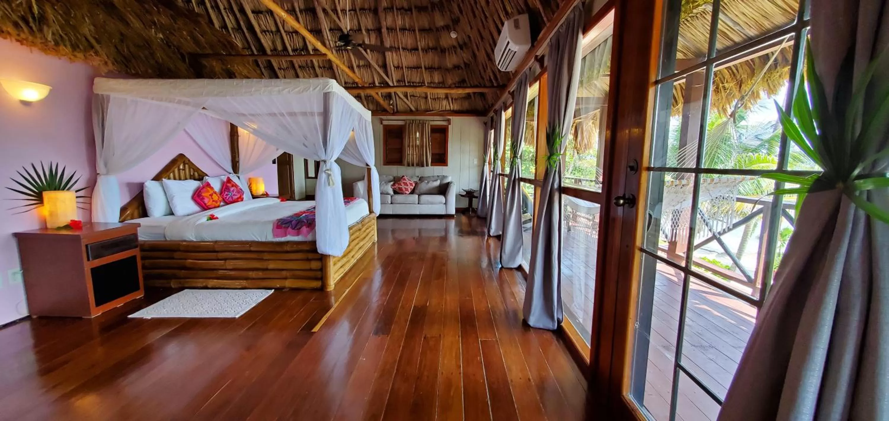 Bed in Portofino Beach Resort-An Authentic Island Escape!