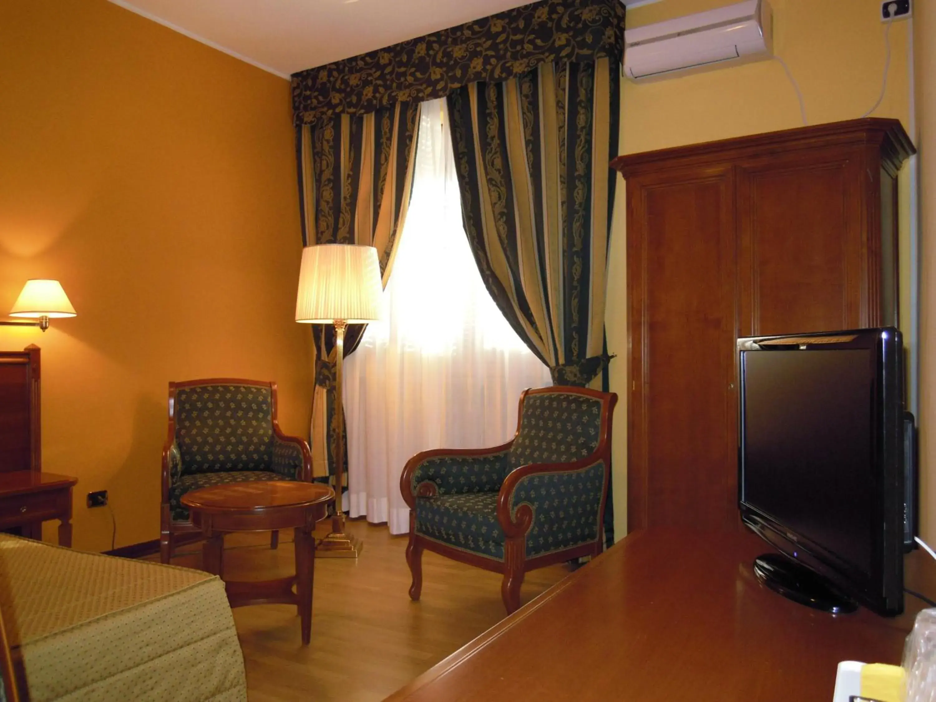 Bed, TV/Entertainment Center in Hotel Il Vigneto