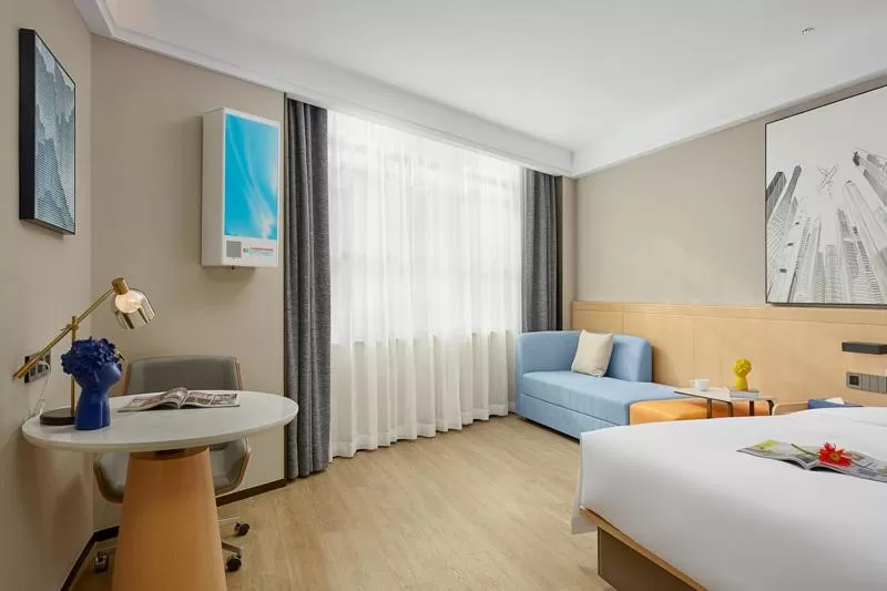 Seating area, Bed in Fengyue Light Shang Hotel Guangzhou Baiyun Airport Store