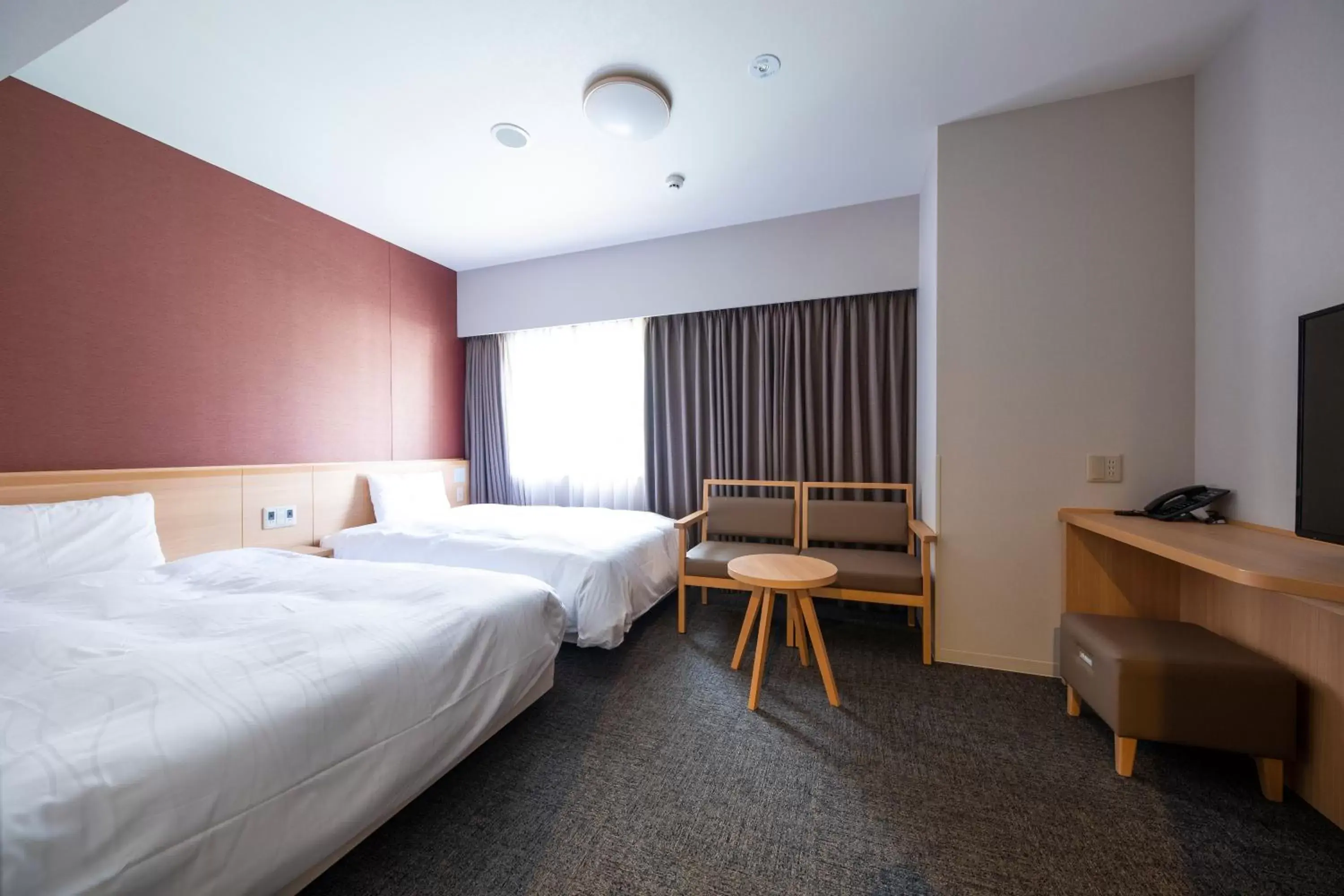 Bed in Dormy Inn Premium Nagasaki Ekimae