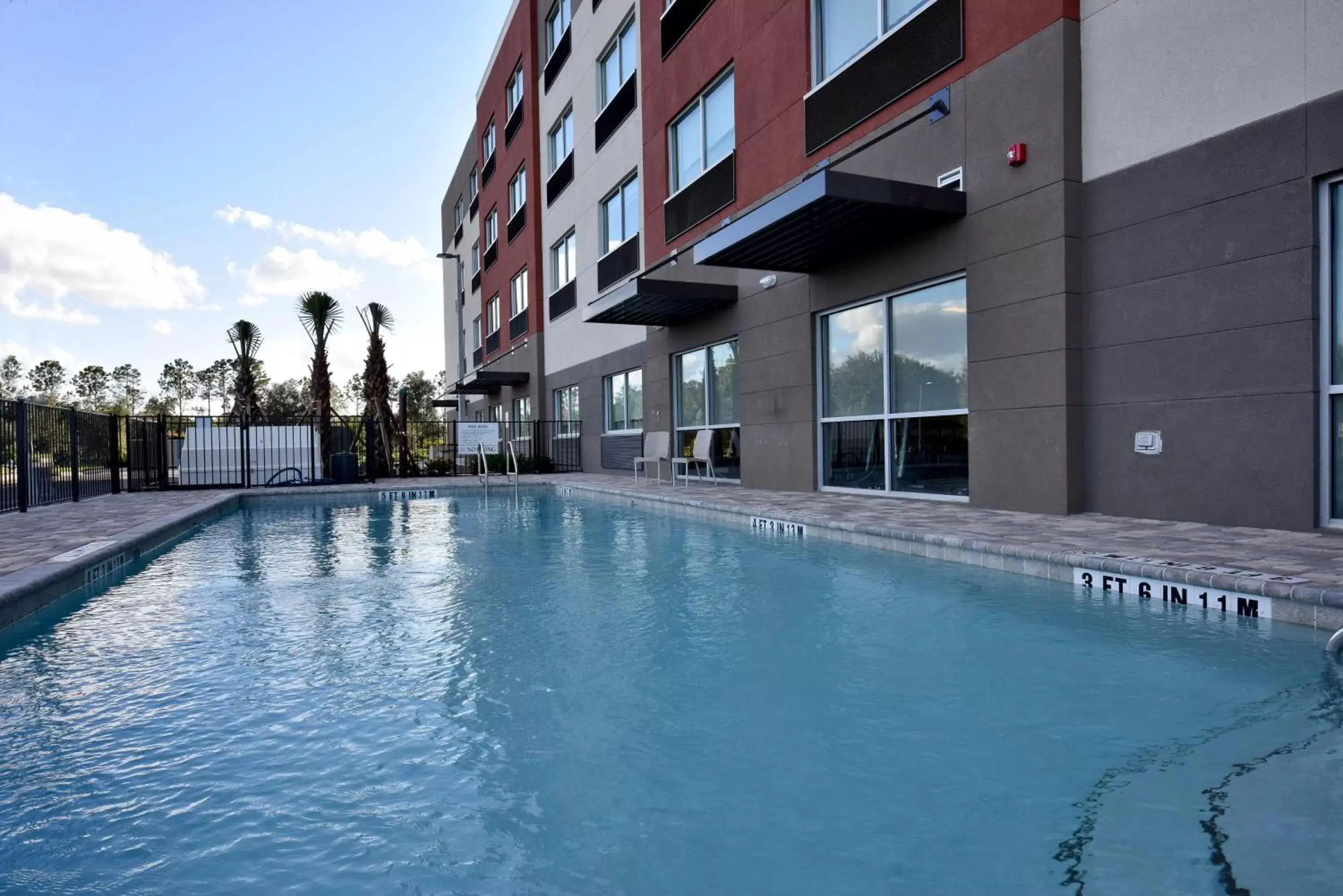 Swimming Pool in Holiday Inn Express & Suites - Orlando - Lake Nona Area, an IHG Hotel
