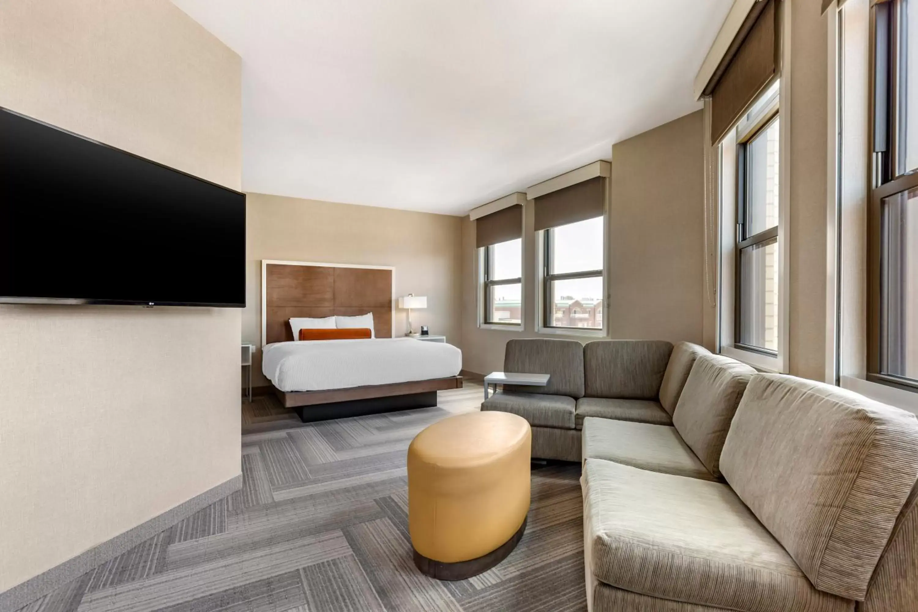 Bed, Seating Area in Cambria Hotel Rockville