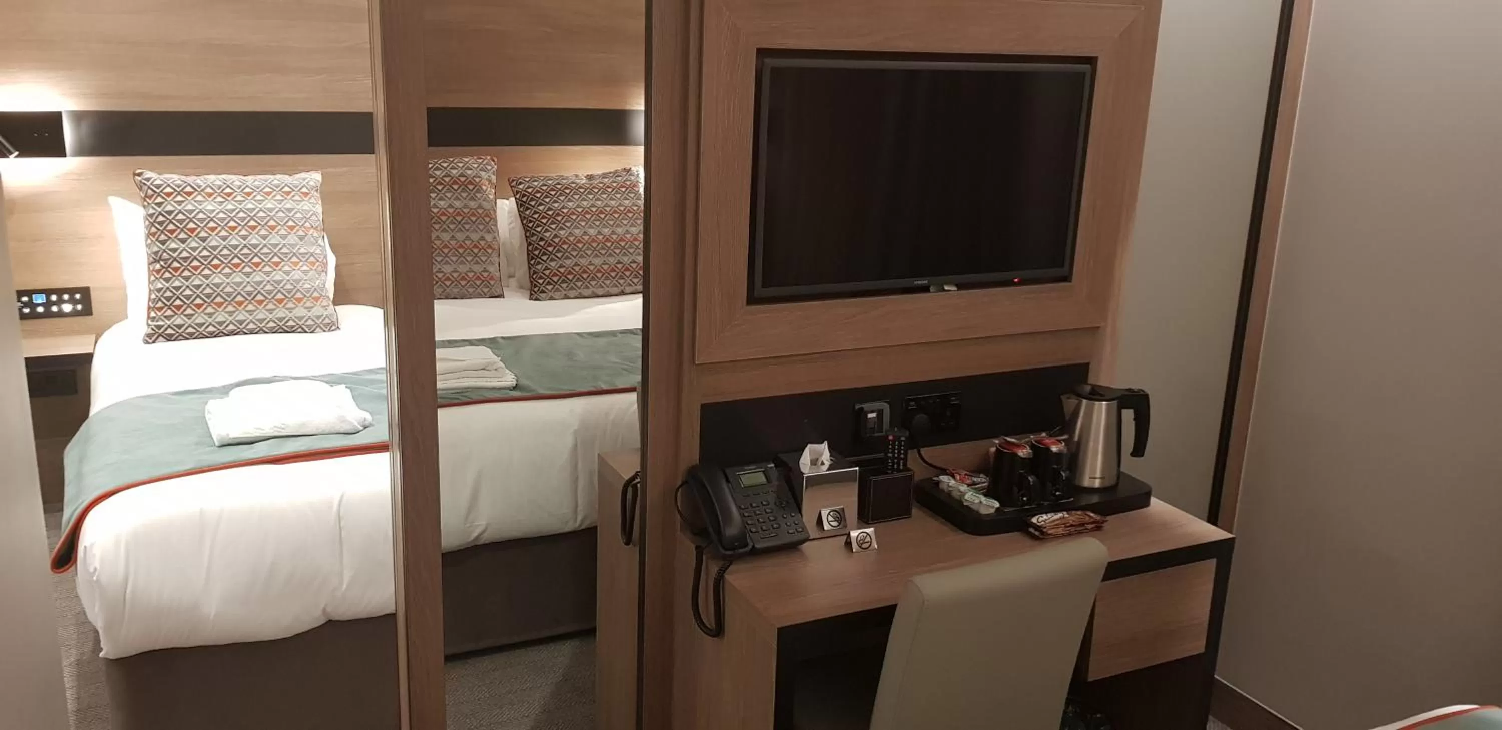 Bed in Merit Kensington Hotel