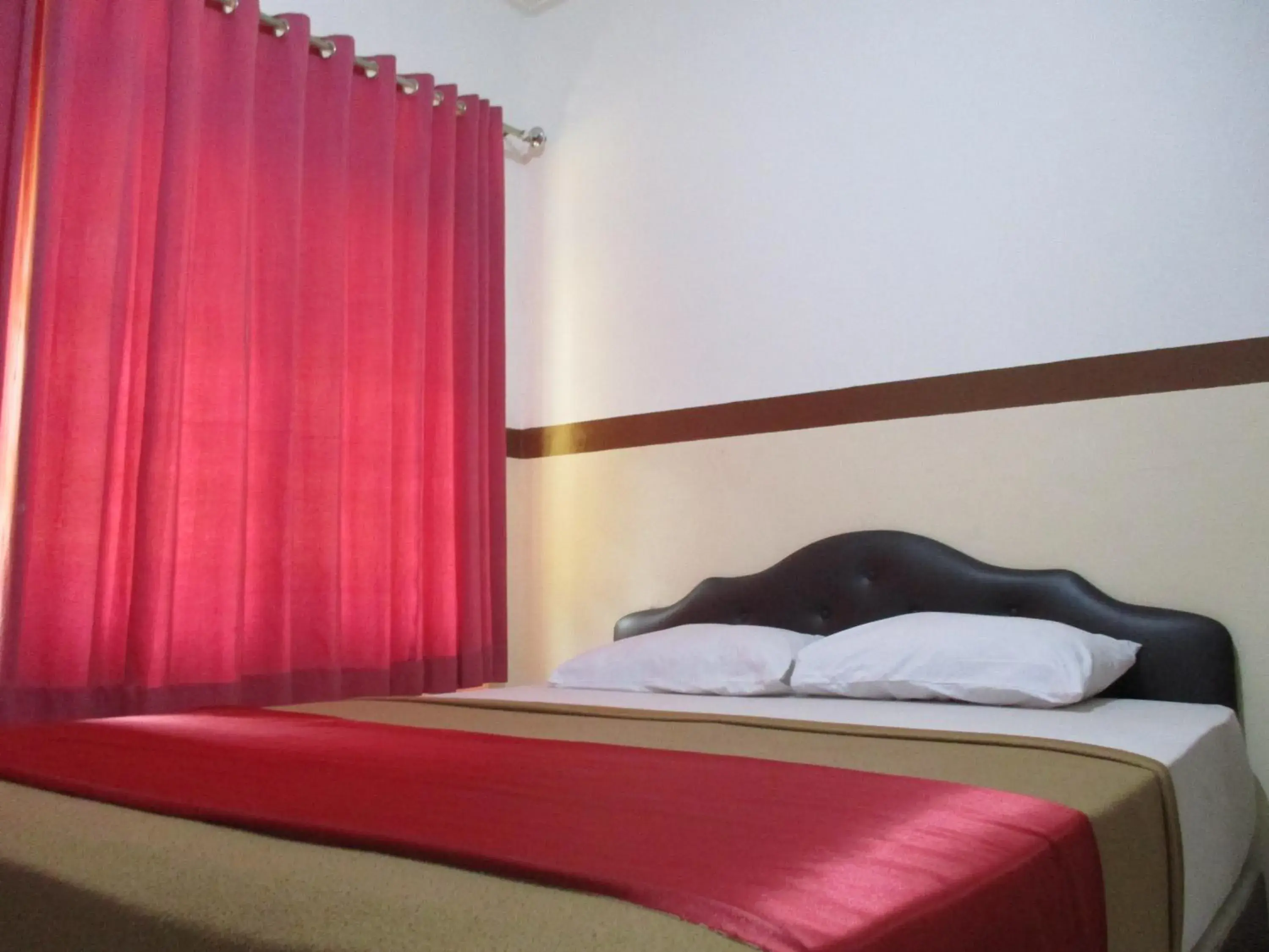 Bed in Hotel Tugu Asri