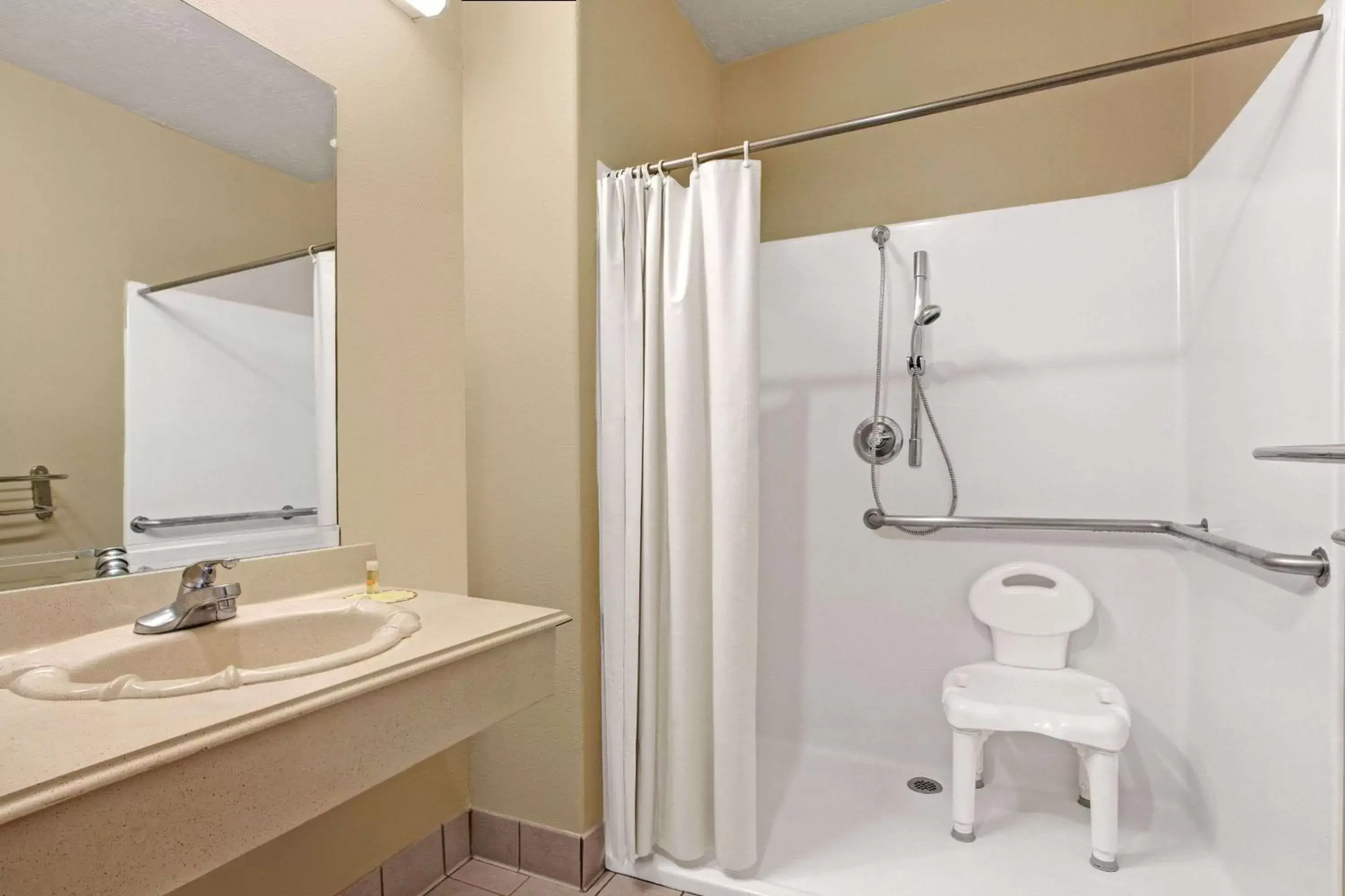 Bathroom in Days Inn & Suites by Wyndham Houston North - Spring