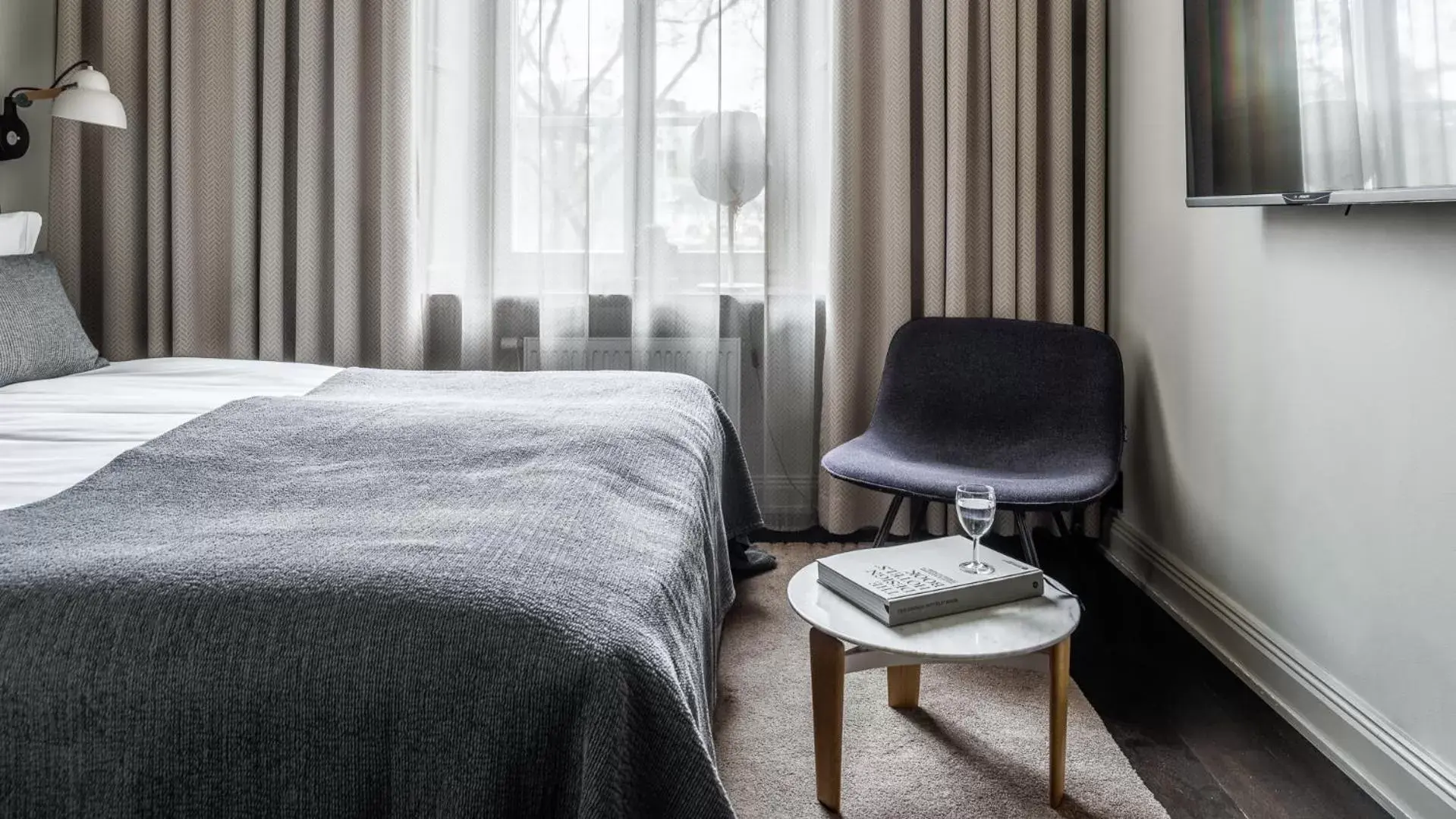 Bed, Seating Area in Nobis Hotel Stockholm, a Member of Design Hotels™