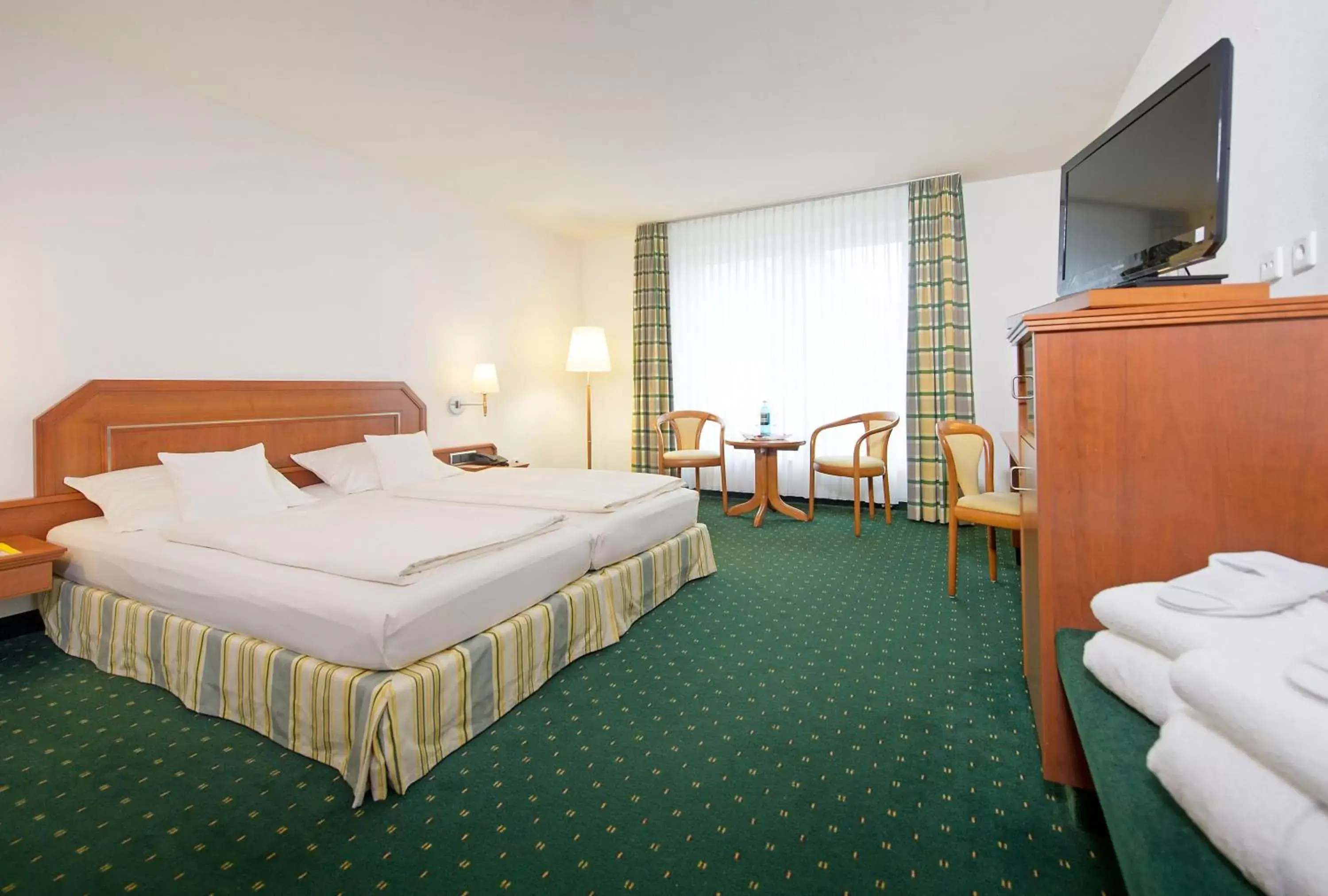 Photo of the whole room, Bed in Maifeld Sport- und Tagungshotel