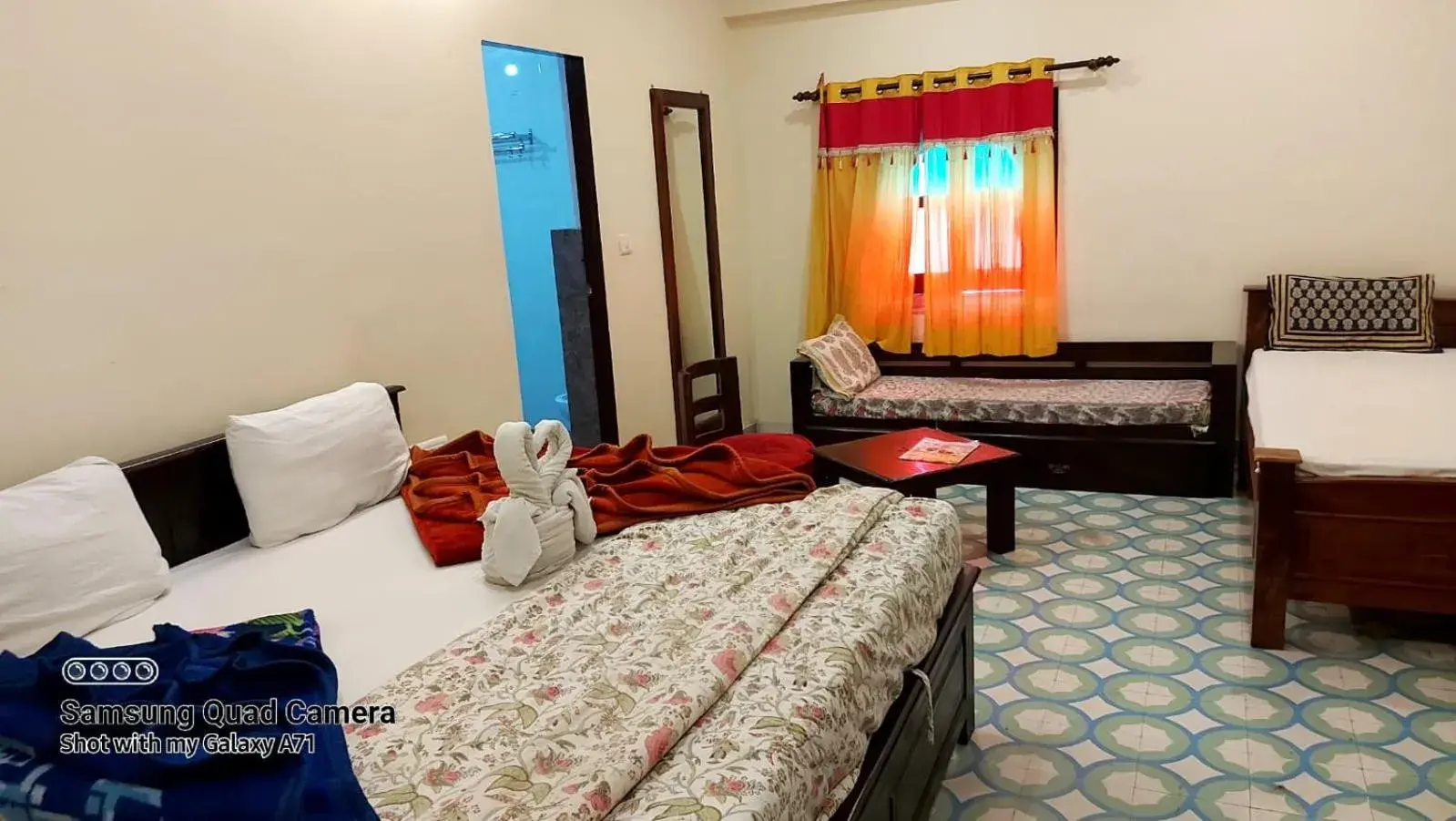 Bed in Rani Mahal Hotel