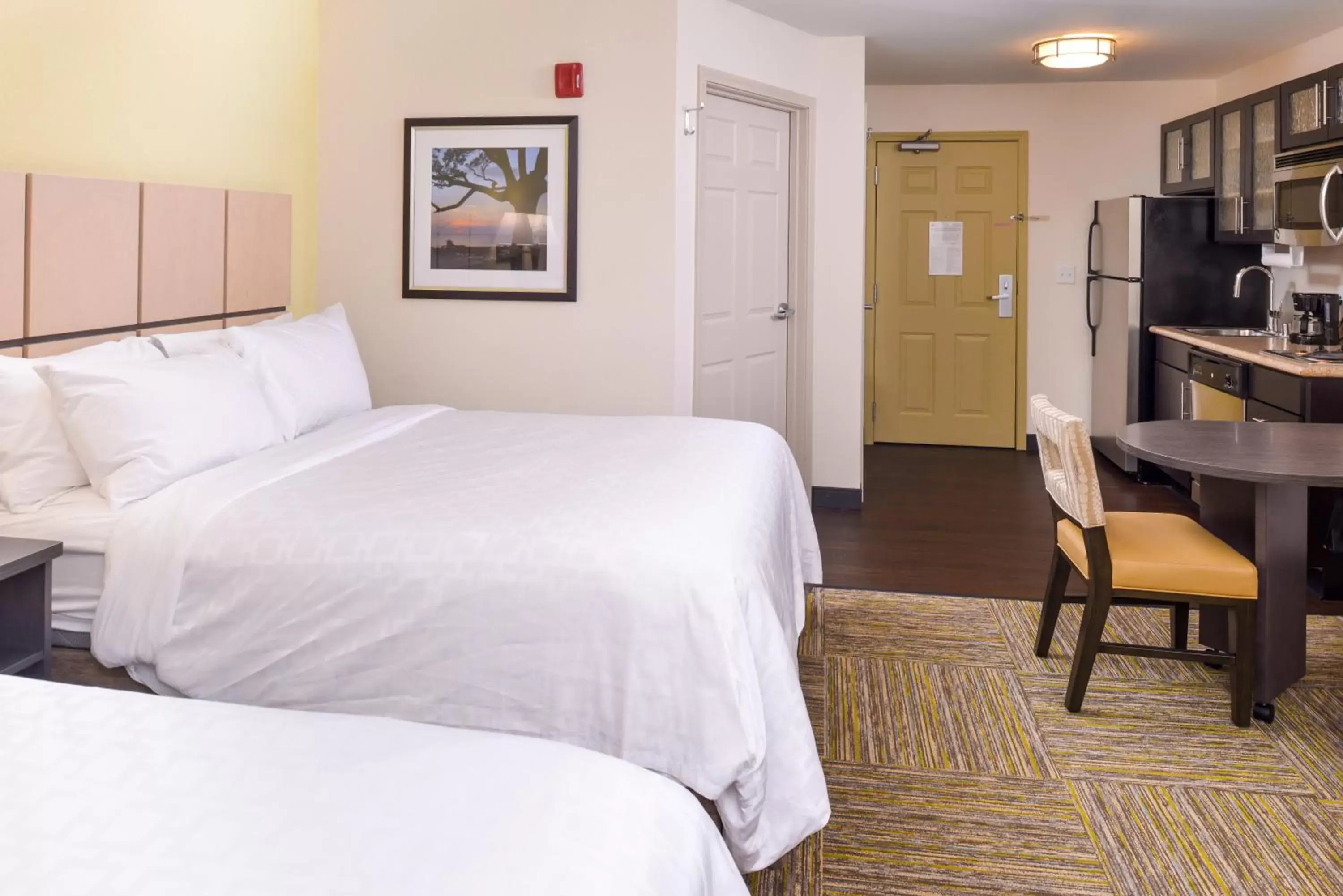 Bed in Candlewood Suites - Plano North, an IHG Hotel