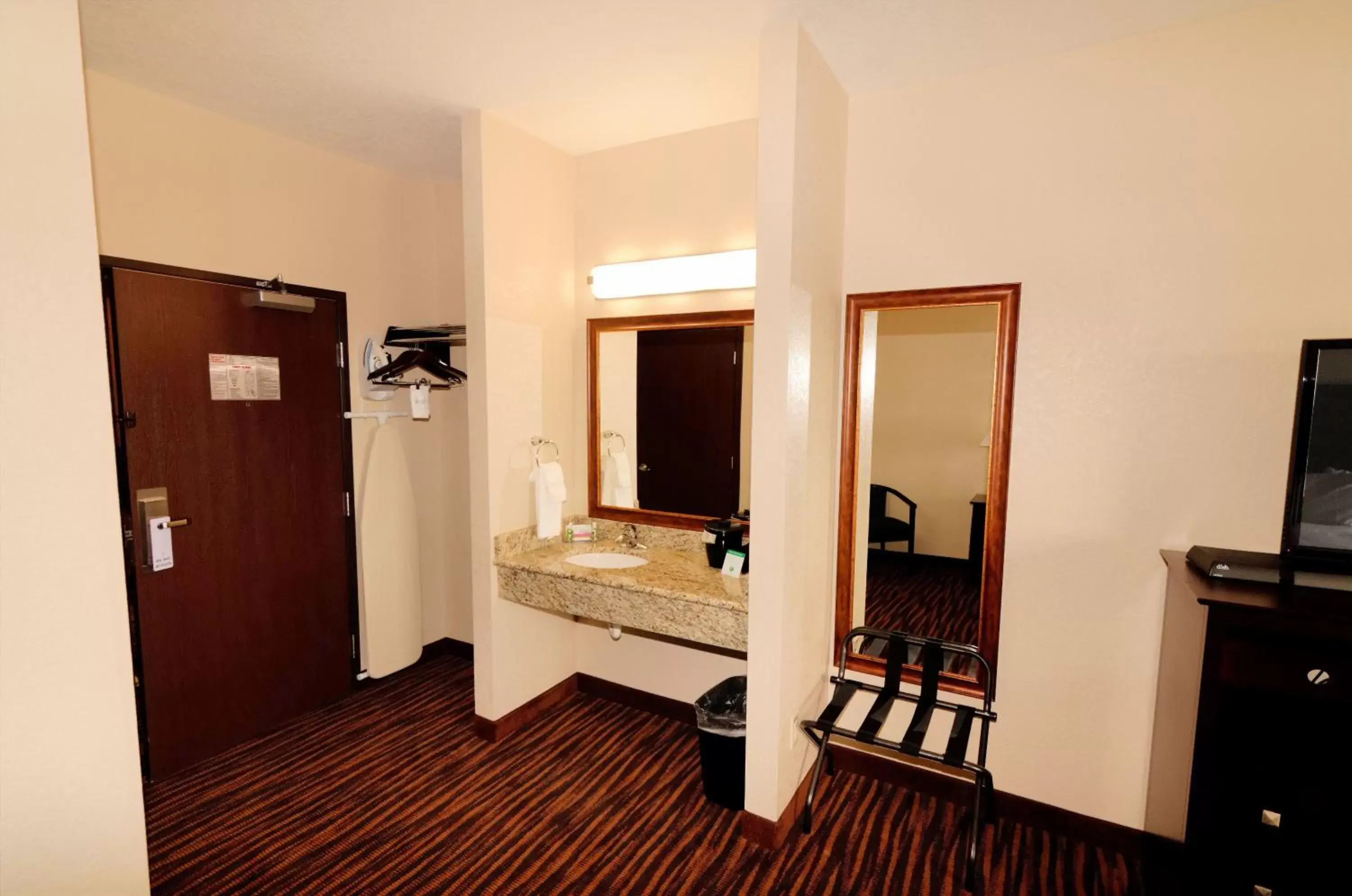 Bathroom, TV/Entertainment Center in Cobblestone Inn & Suites - Denison | Oak Ridge