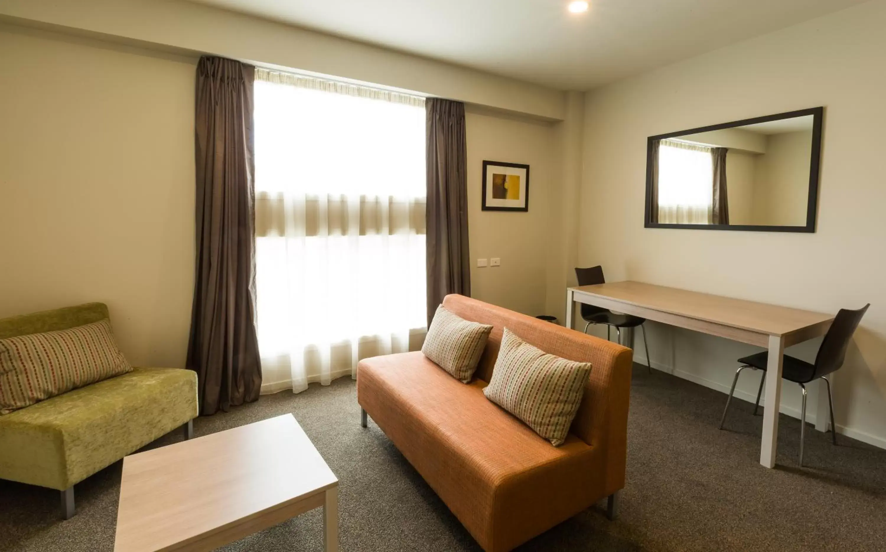 Living room, Seating Area in Ramada Suites by Wyndham Christchurch City
