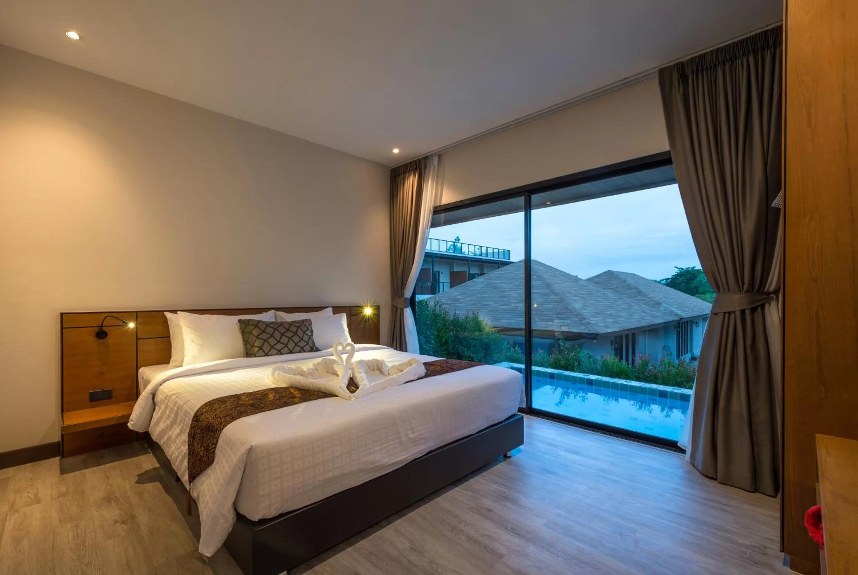 Bed in Cher​mantra​ Aonang​ Resort & Pool​ Suite