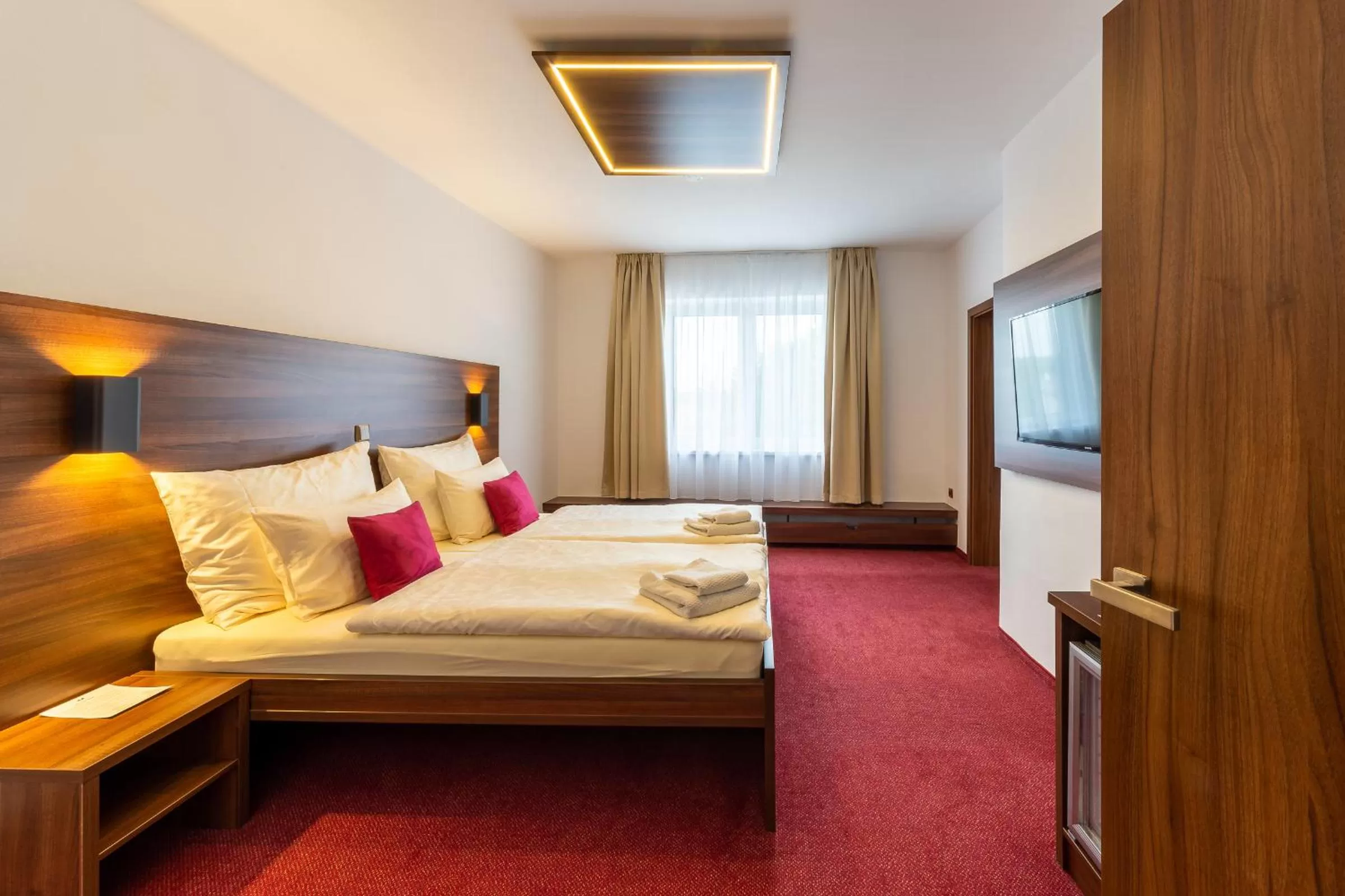 Bed in Bohemia Inn Hotel