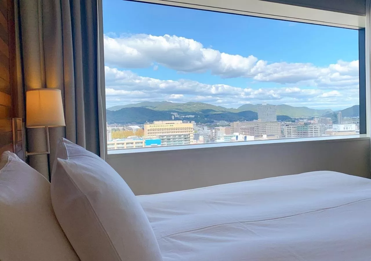View (from property/room), Bed in ANA Crowne Plaza Okayama by IHG