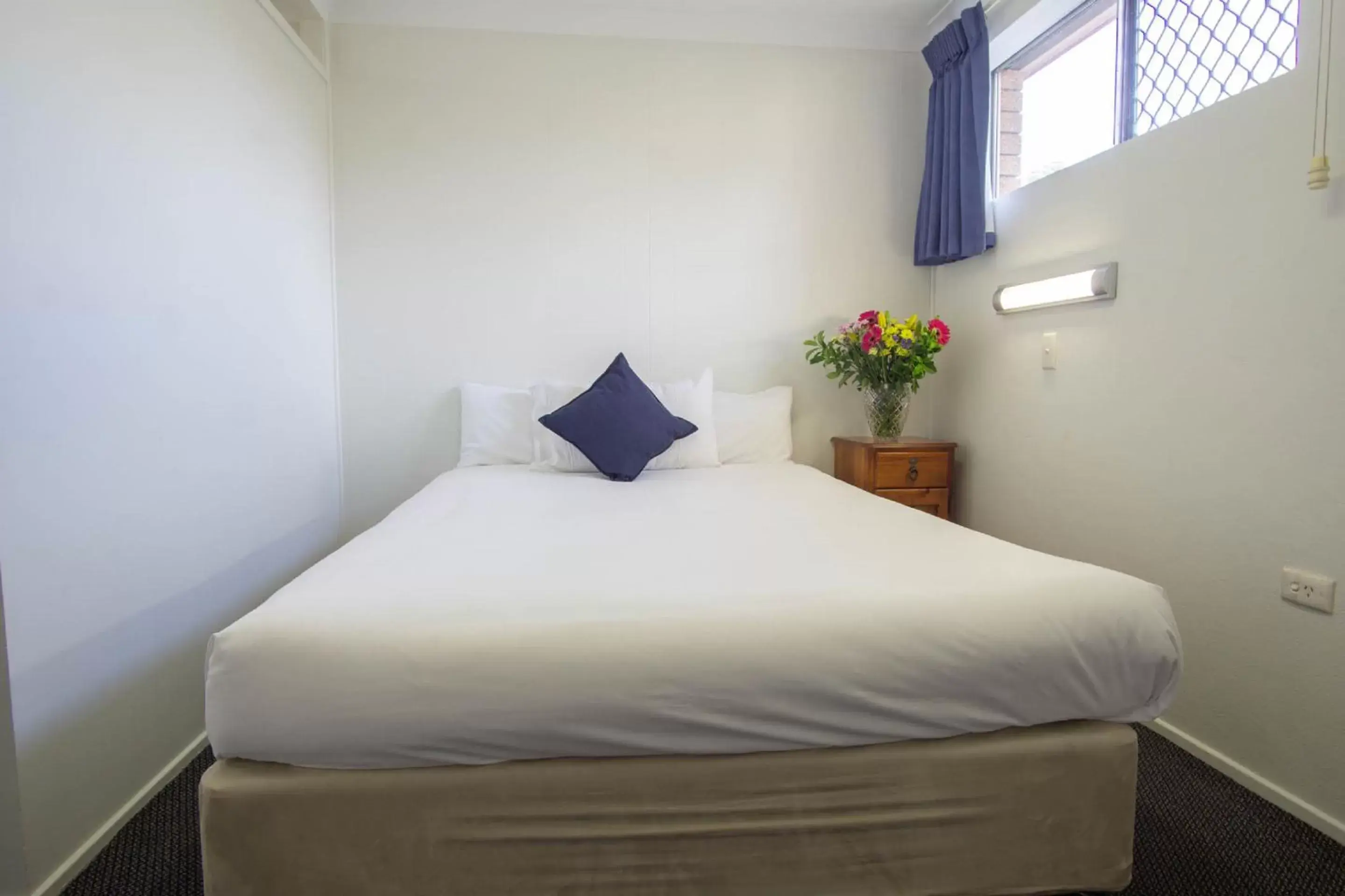 Bed in Acacia Motor Inn