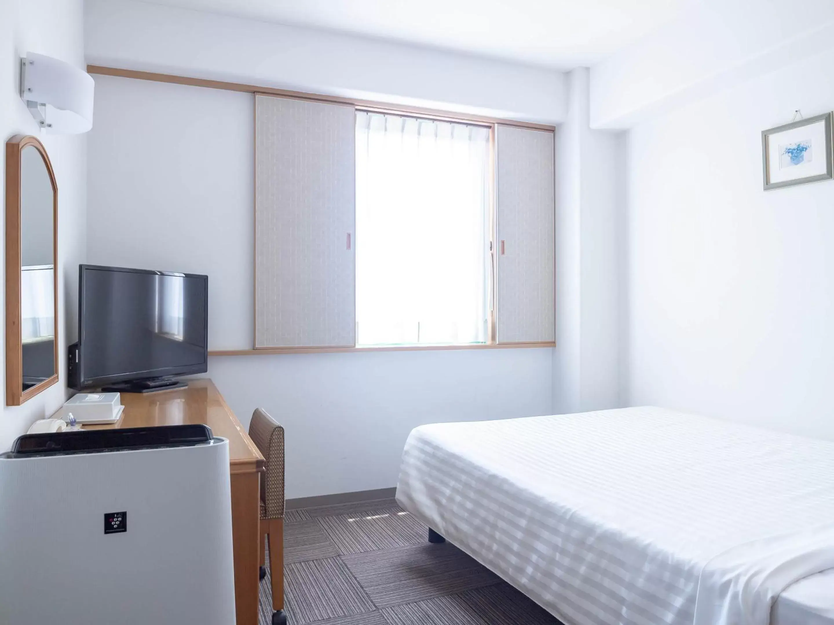 Bedroom, TV/Entertainment Center in Hotel Belleview Nagasaki Dejima