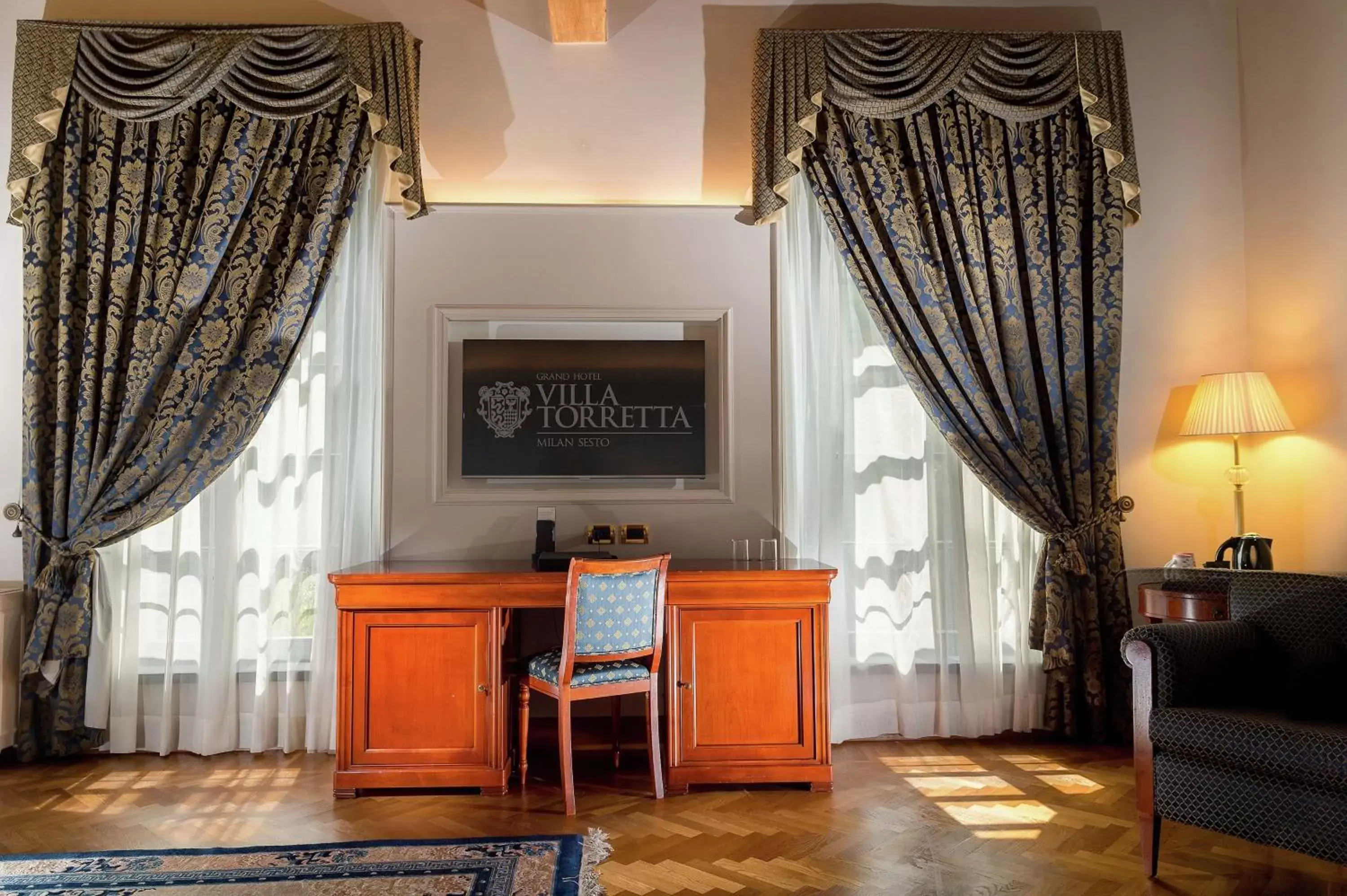 Bed, TV/Entertainment Center in Grand Hotel Villa Torretta, Curio Collection by Hilton