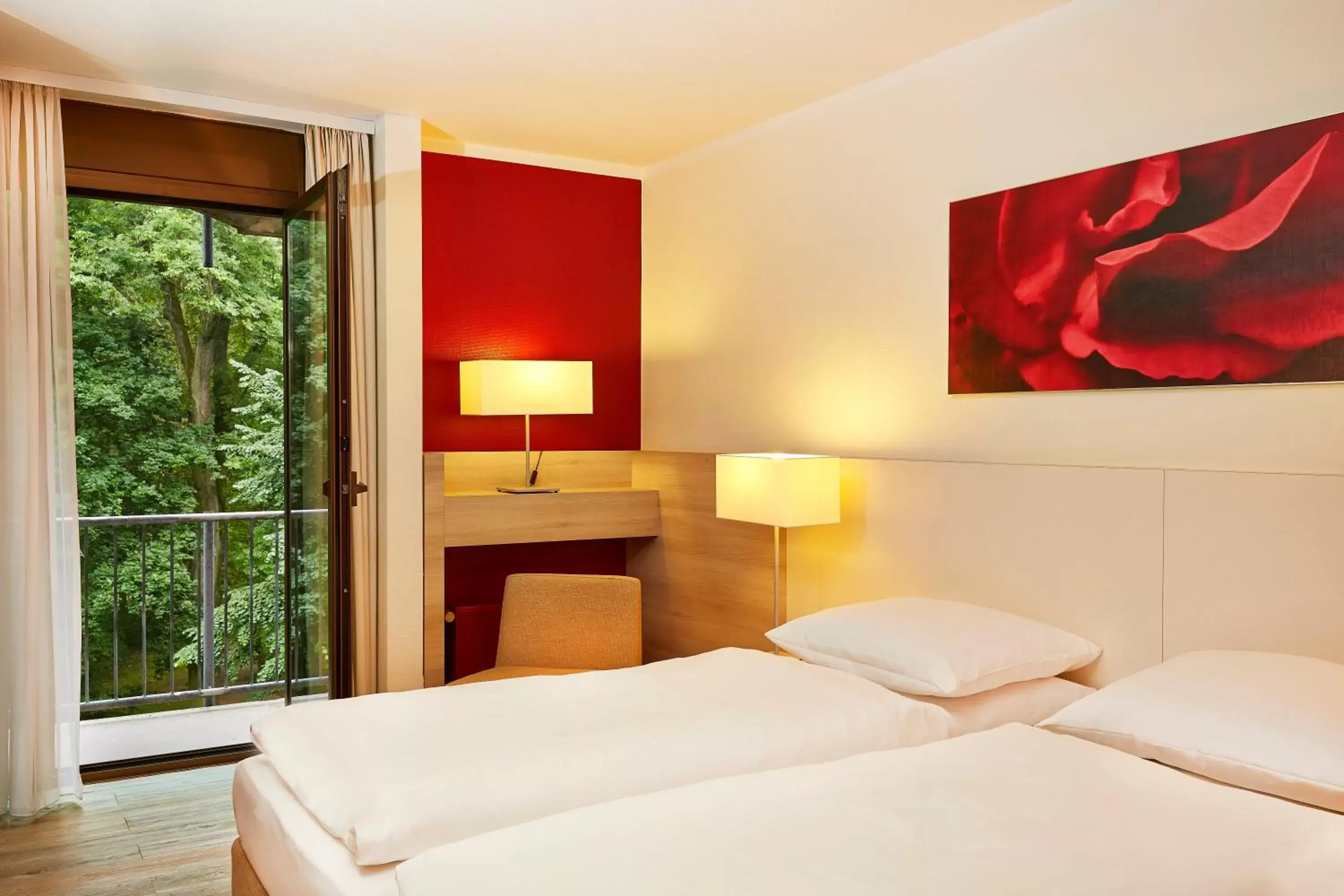 Bedroom, Bed in H+ Hotel Bad Soden