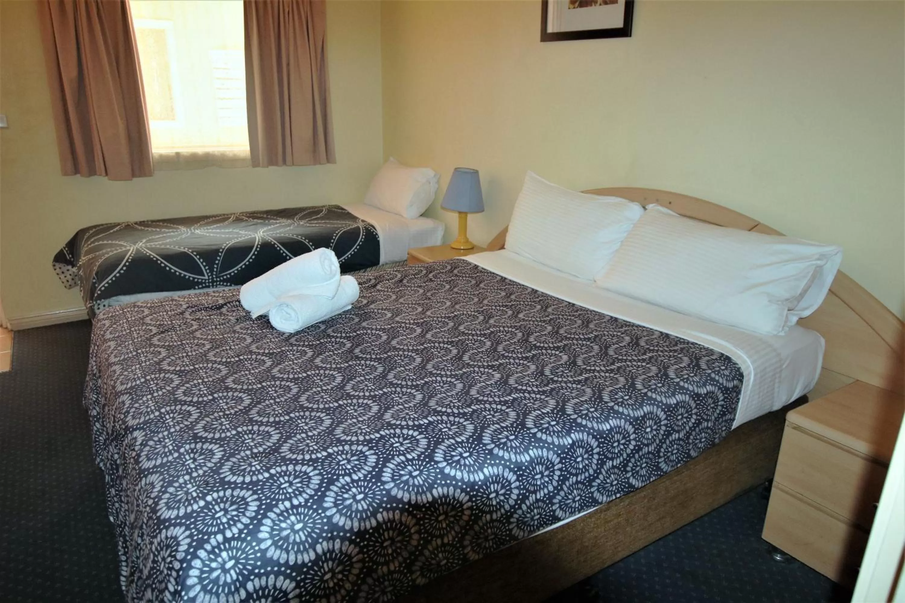 Bed in City East Motel