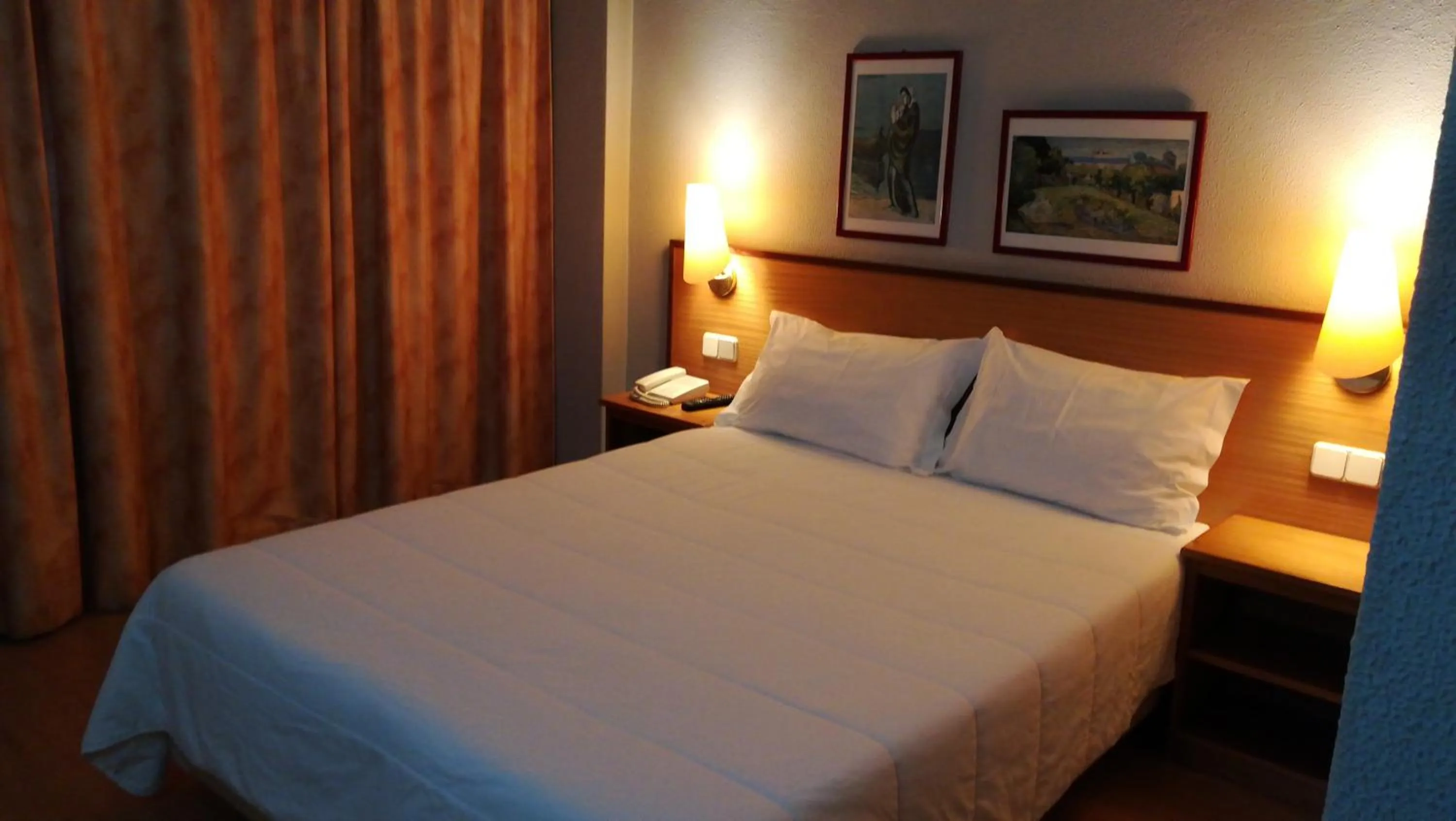 Bed in Hotel Dom Vilas