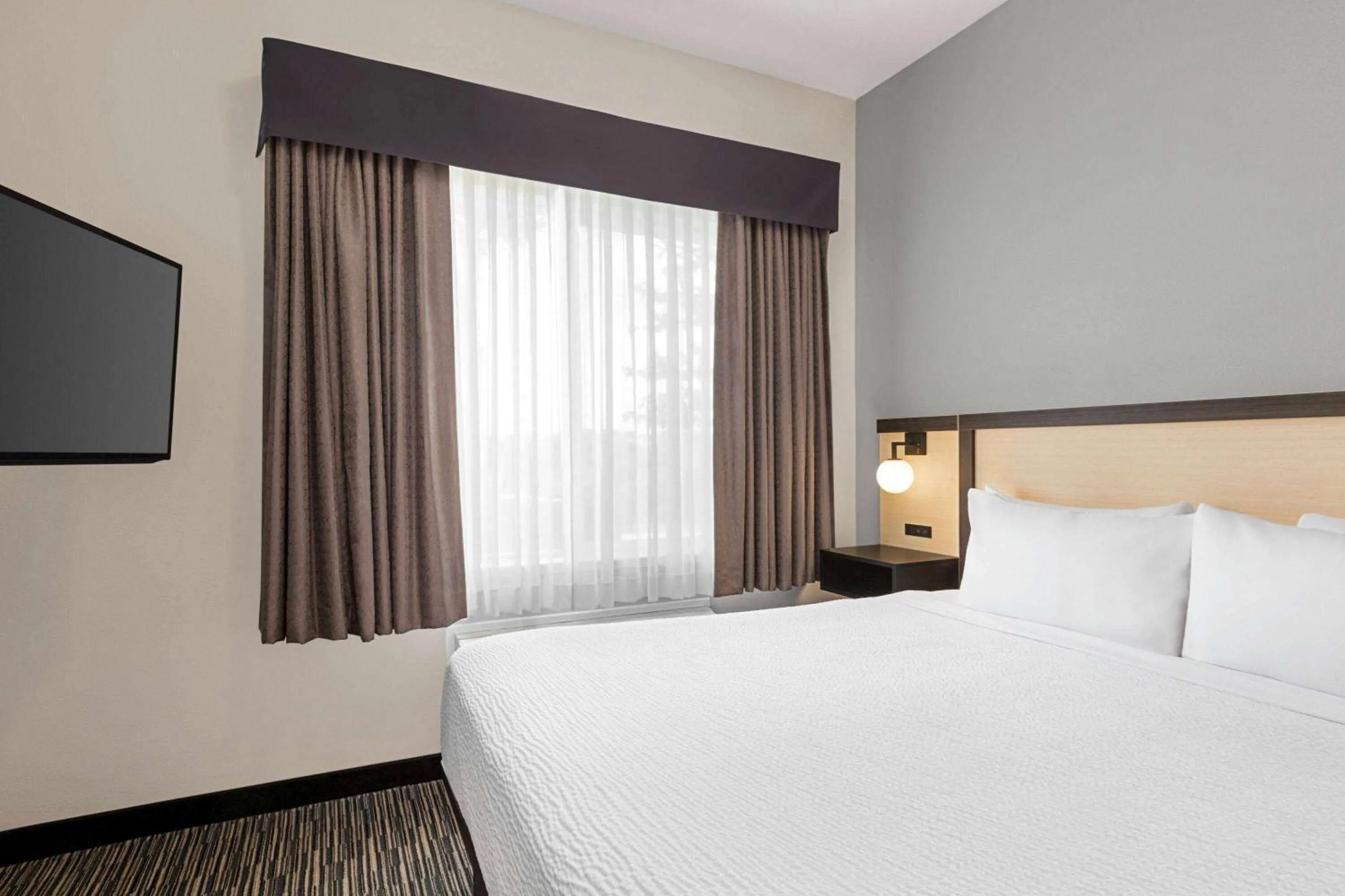 Bed in Ramada by Wyndham Marina