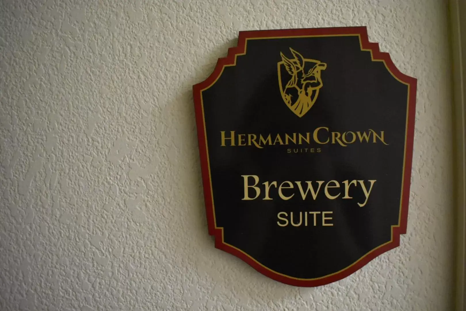 Property logo or sign in Hermann Crown Suites