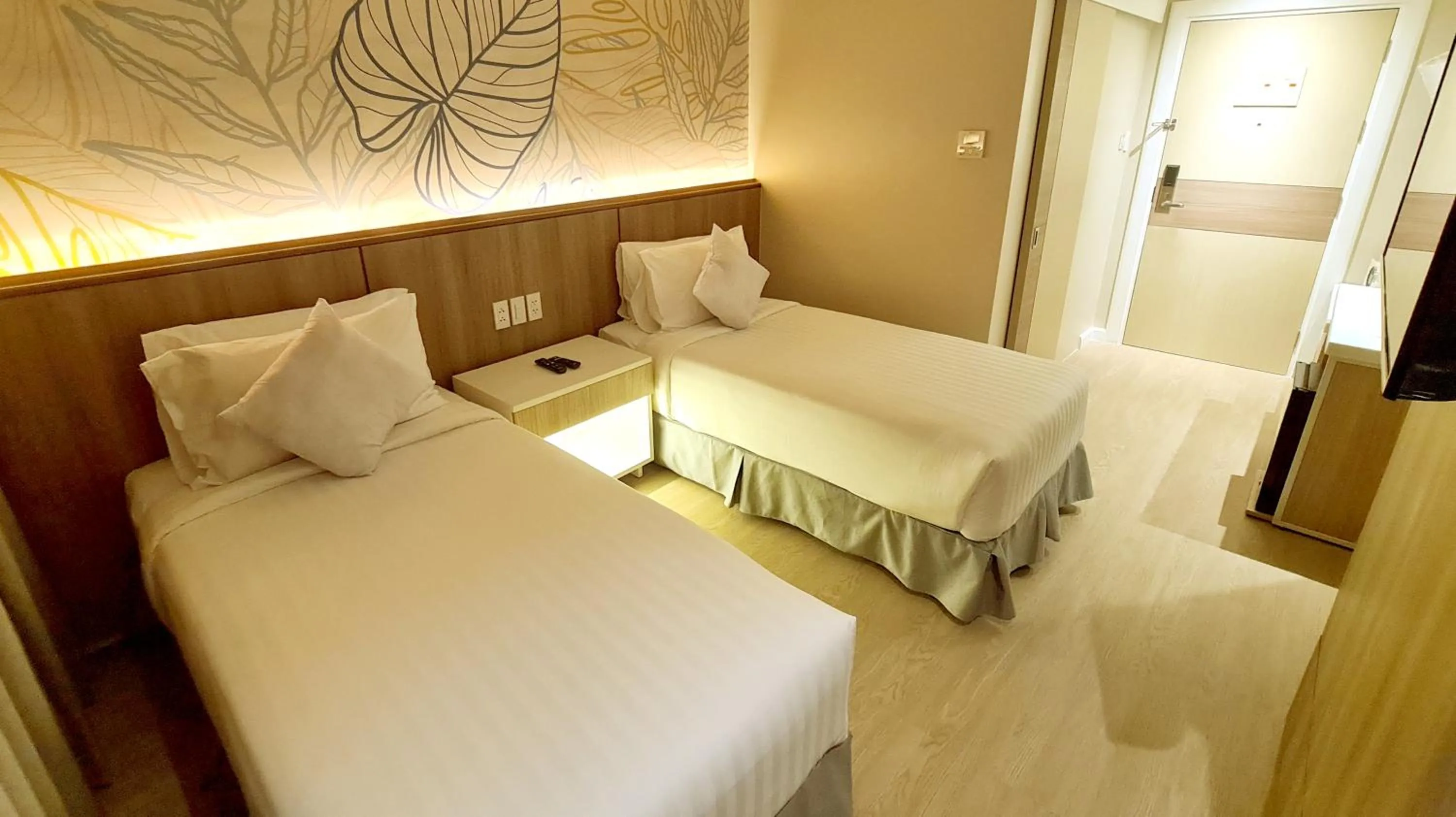 Bed in Harolds Hotel Quezon City