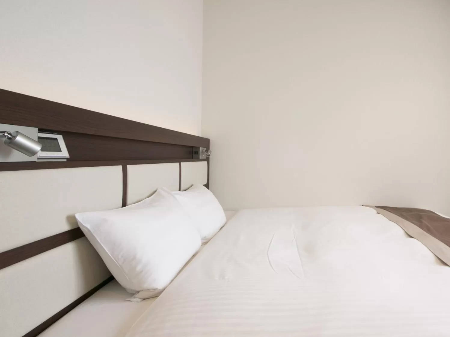 Bed in Urban Hotel Minami Kusatsu