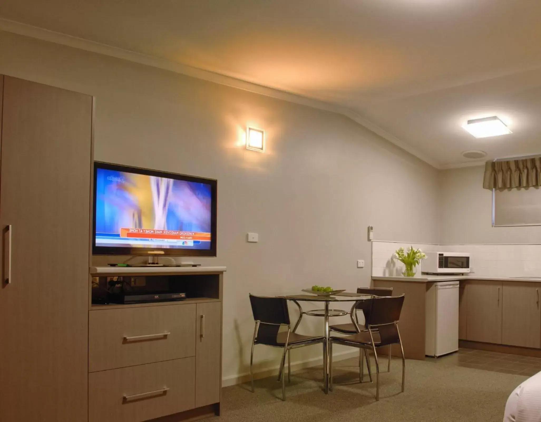 Photo of the whole room, TV/Entertainment Center in Tower Motor Inn