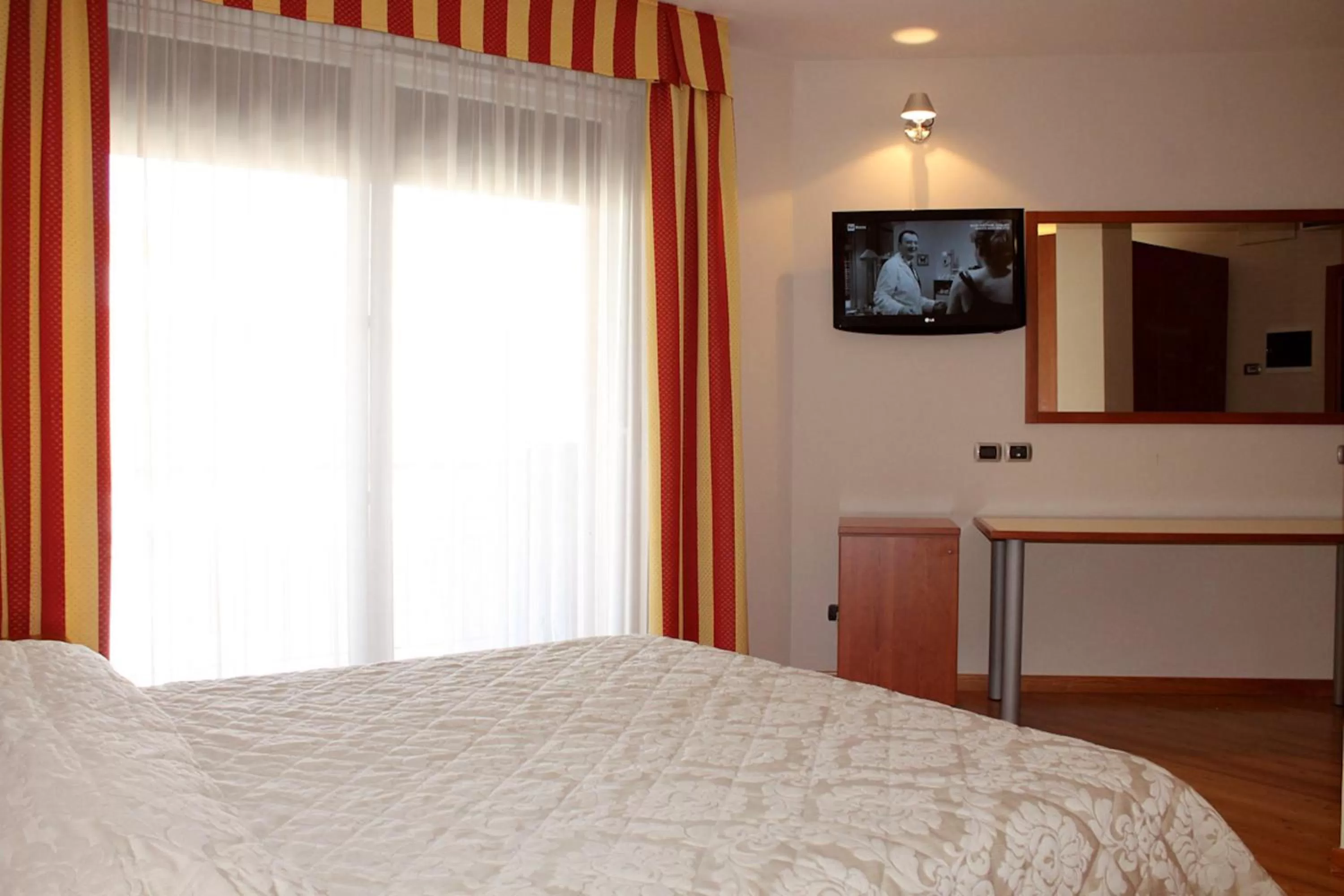 Bed in Hotel Rubicone