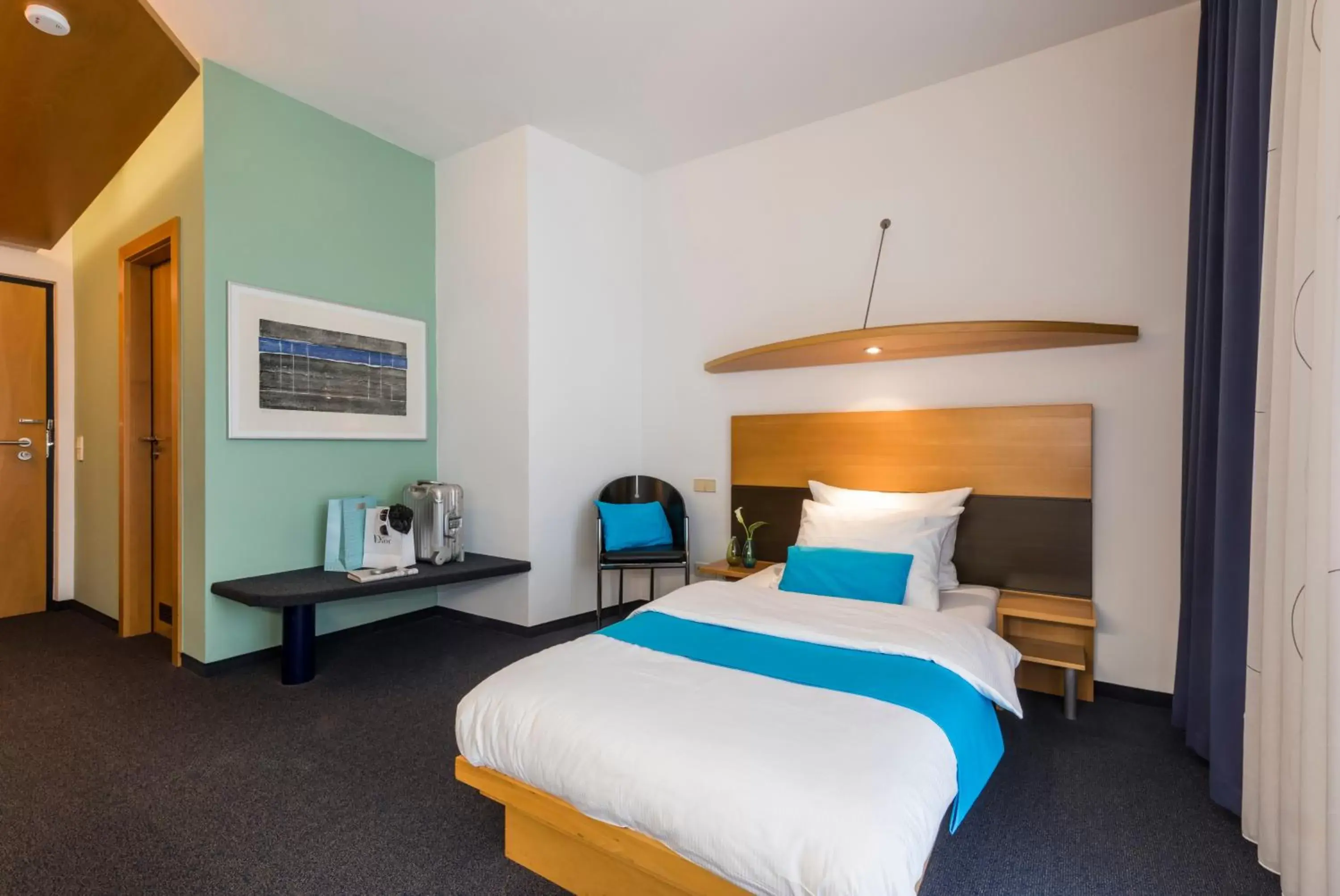 Photo of the whole room, Bed in SEEhotel Friedrichshafen