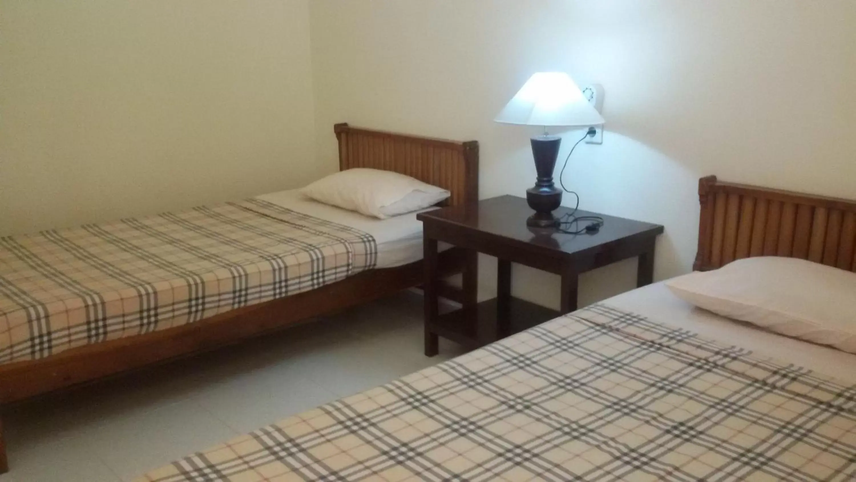 Bed in Lovina Beach Hotel