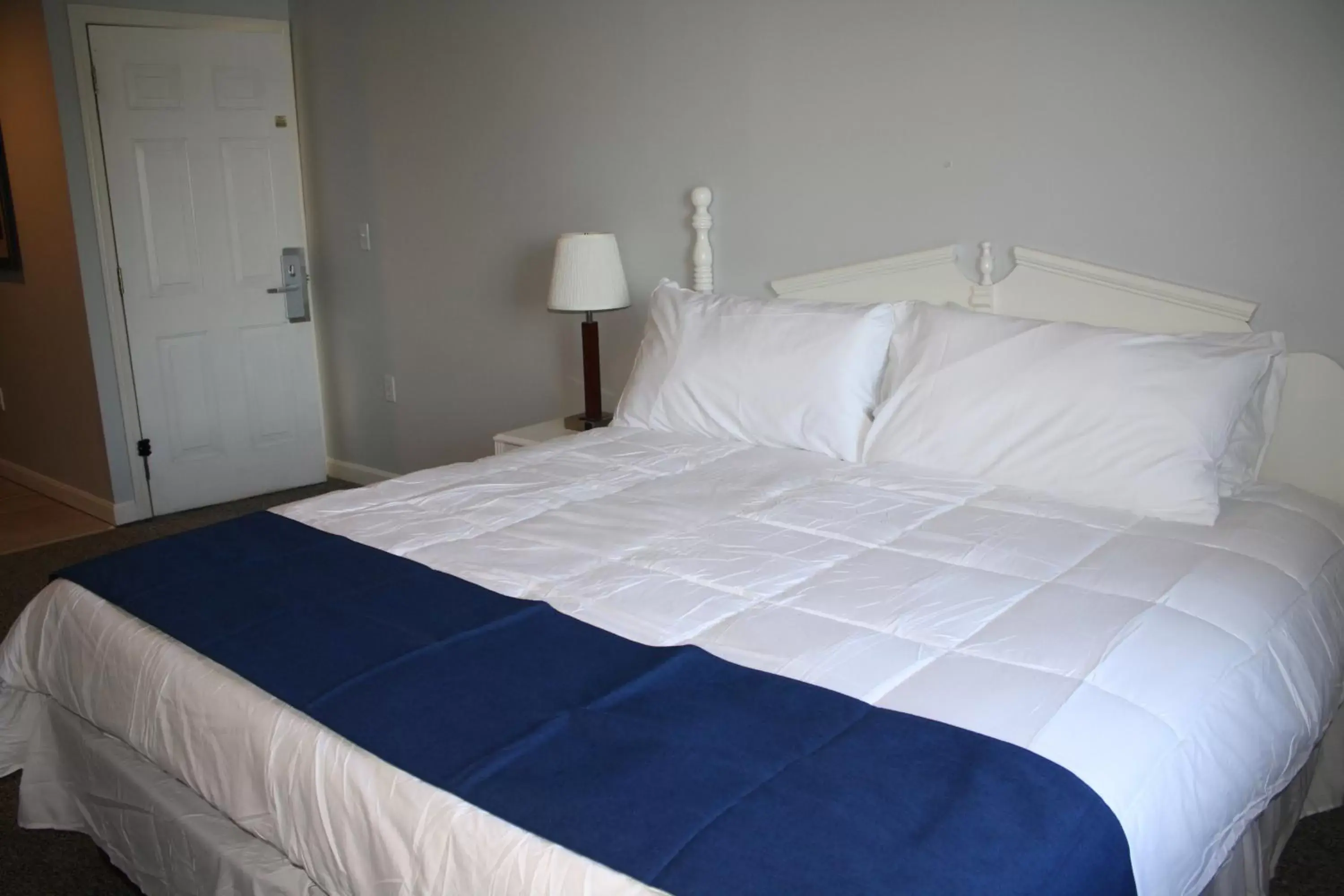Bed in Winnisquam Lake Inn