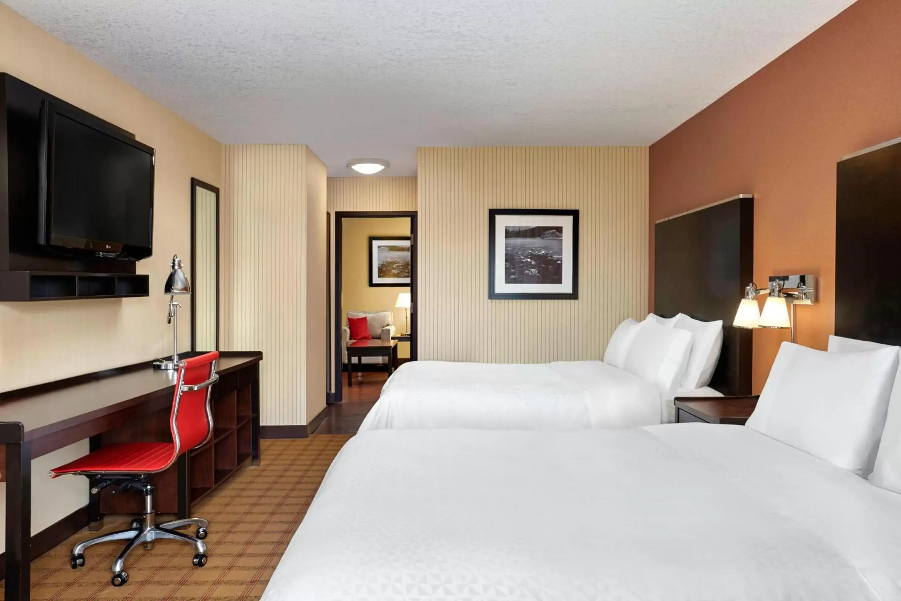 Bedroom, Bed in Four Points by Sheraton Hotel & Suites Calgary West