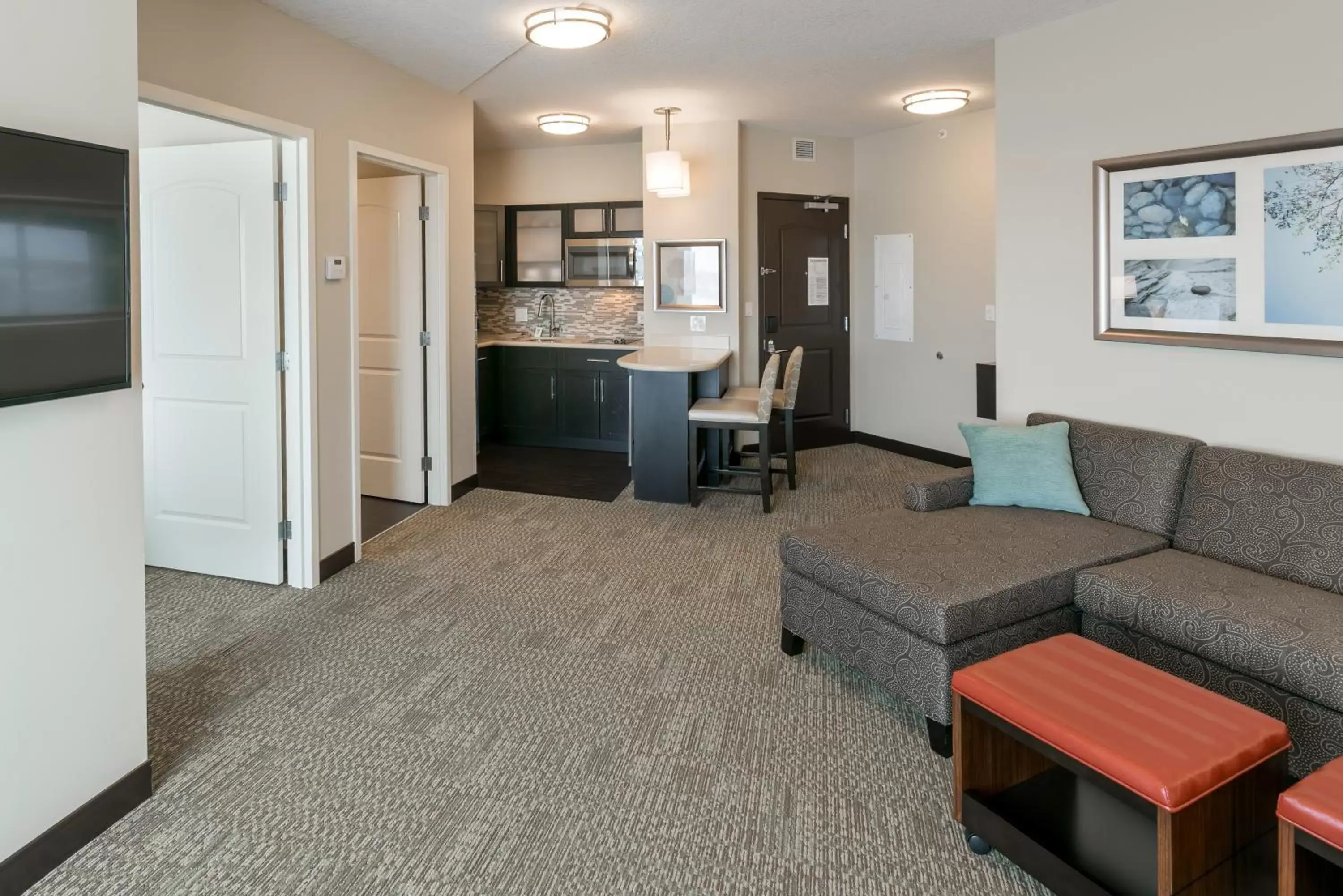 Photo of the whole room, Seating Area in Staybridge Suites - Saskatoon - University, an IHG Hotel