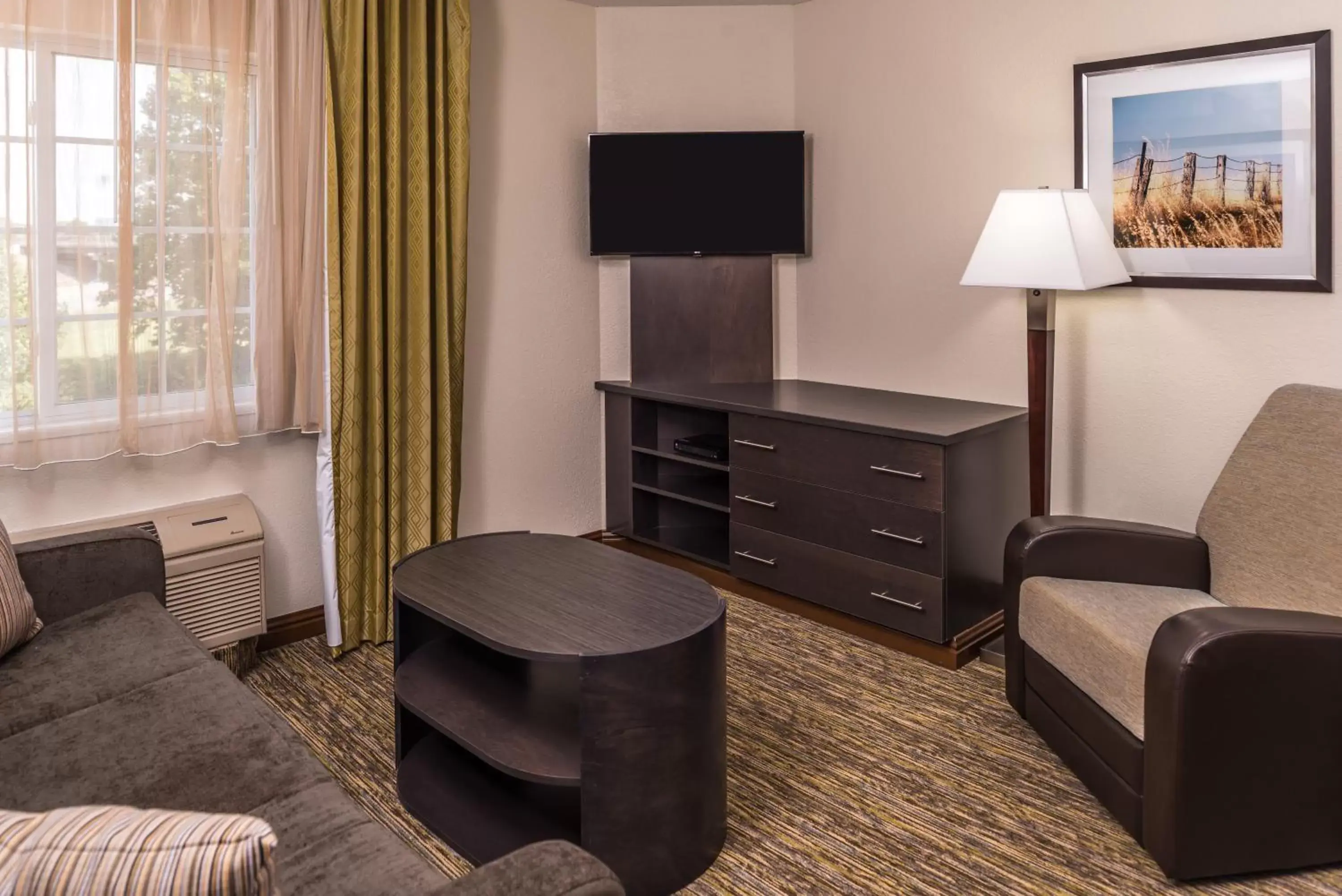 Photo of the whole room, TV/Entertainment Center in Candlewood Suites Kansas City, an IHG Hotel