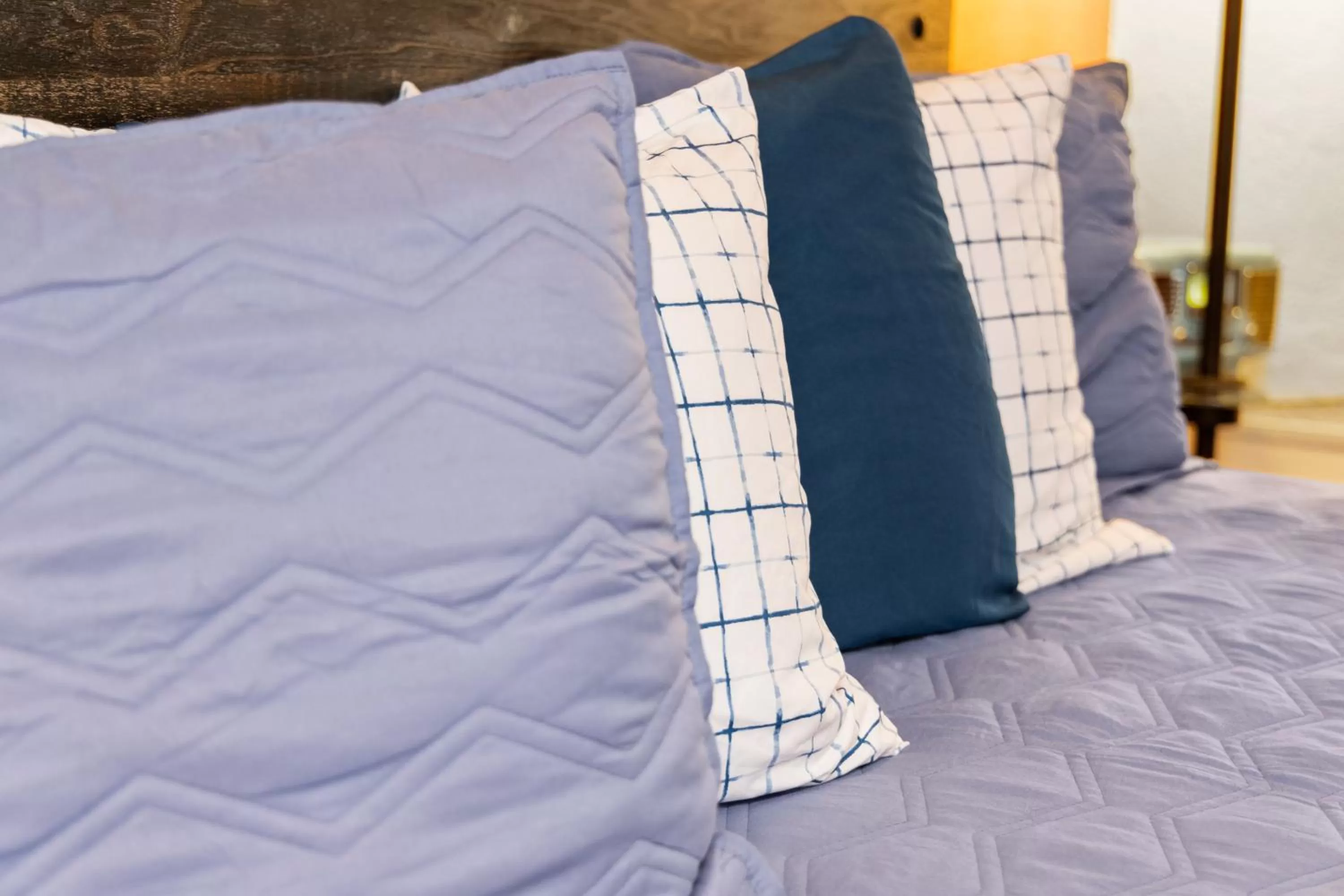 Bed in Americana Inn Motel