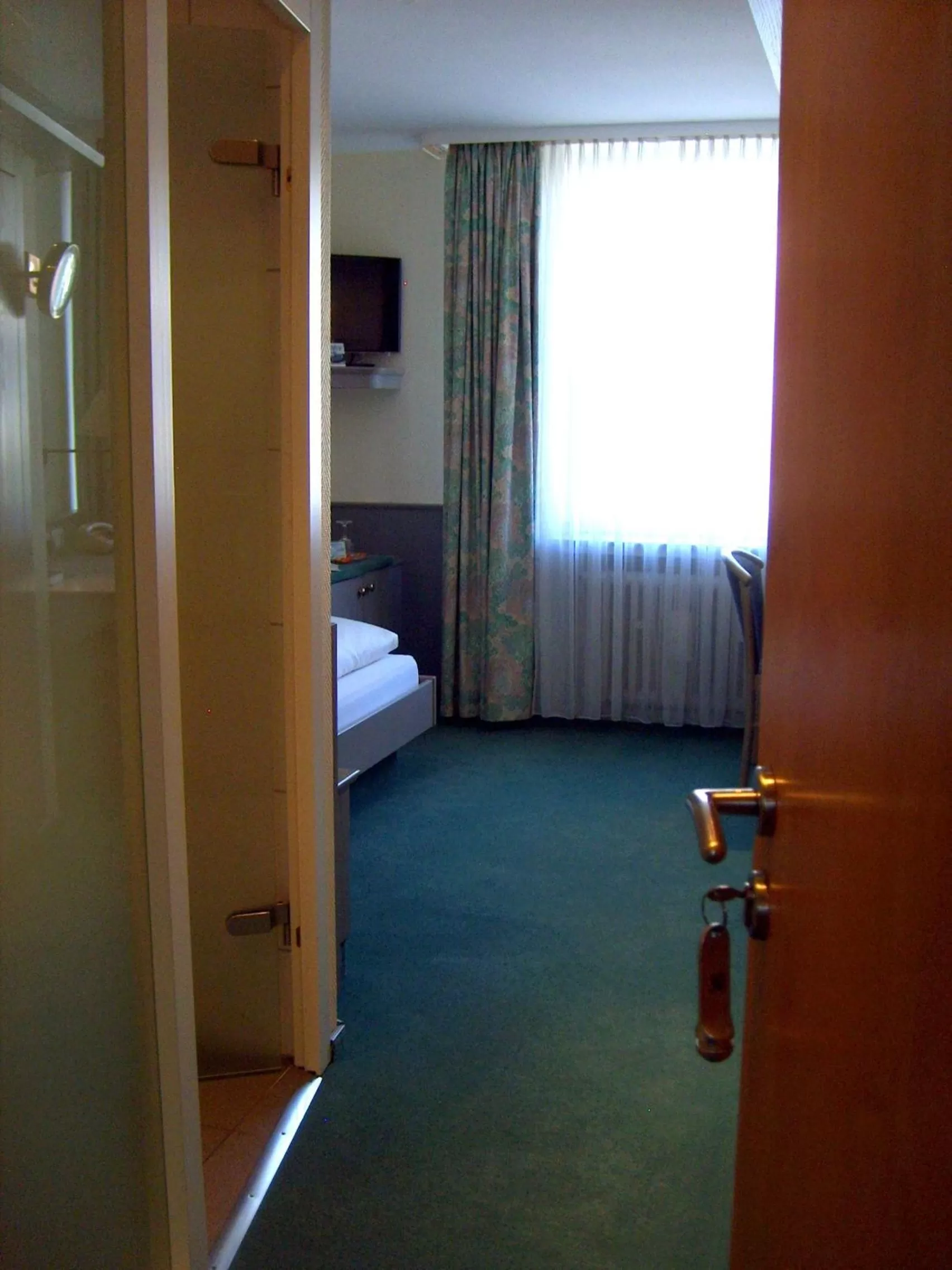 Photo of the whole room, Bed in City Hotel by celina