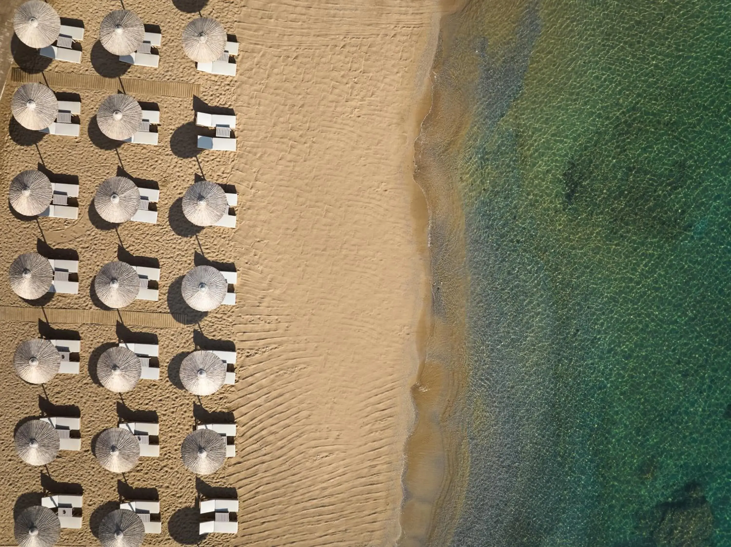 Beach in The Royal Senses Resort Crete, Curio Collection by Hilton