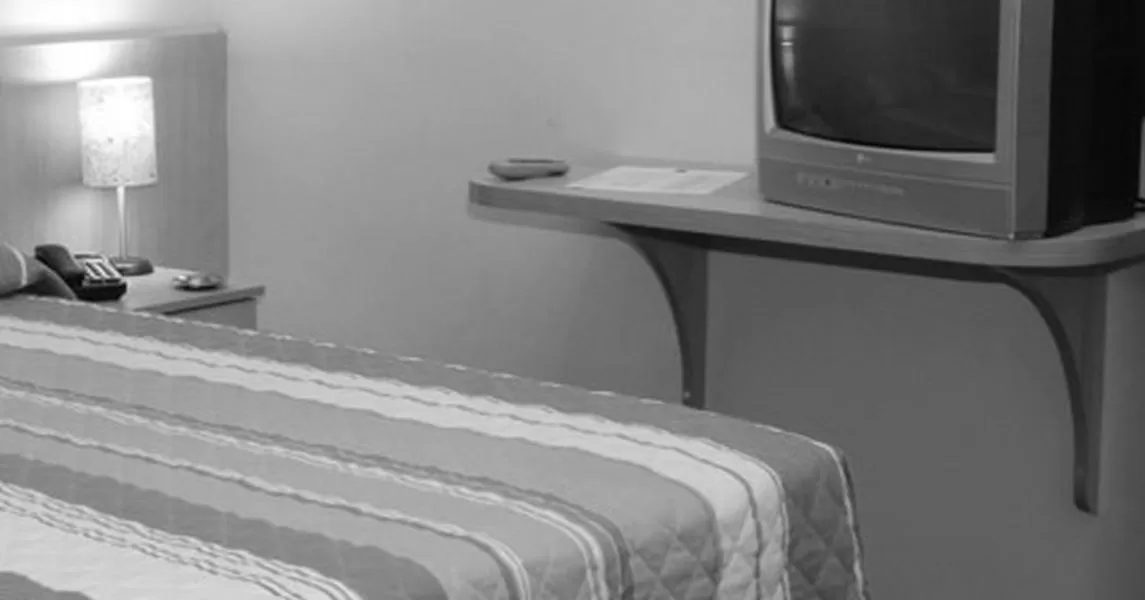 Bed, TV/Entertainment Center in Euro Hotel