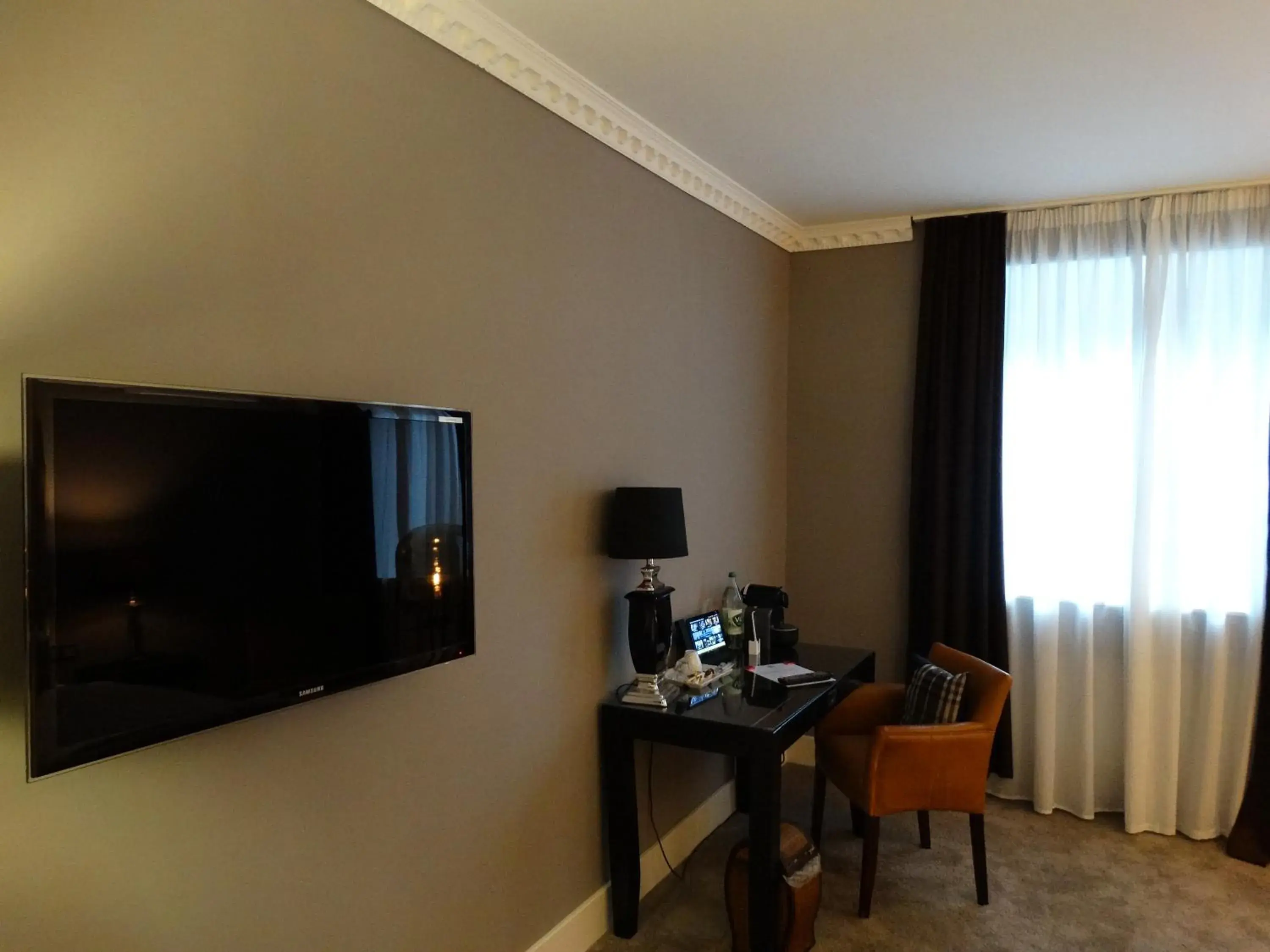 TV and multimedia, TV/Entertainment Center in Boutique-Hotel GEORGES