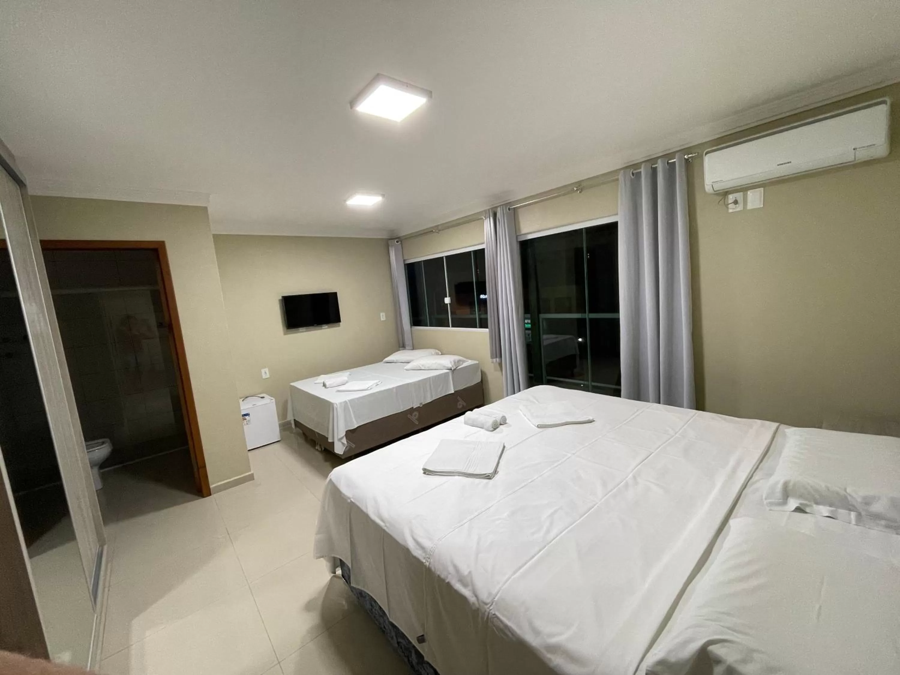 Bed in Pousada Tissiano