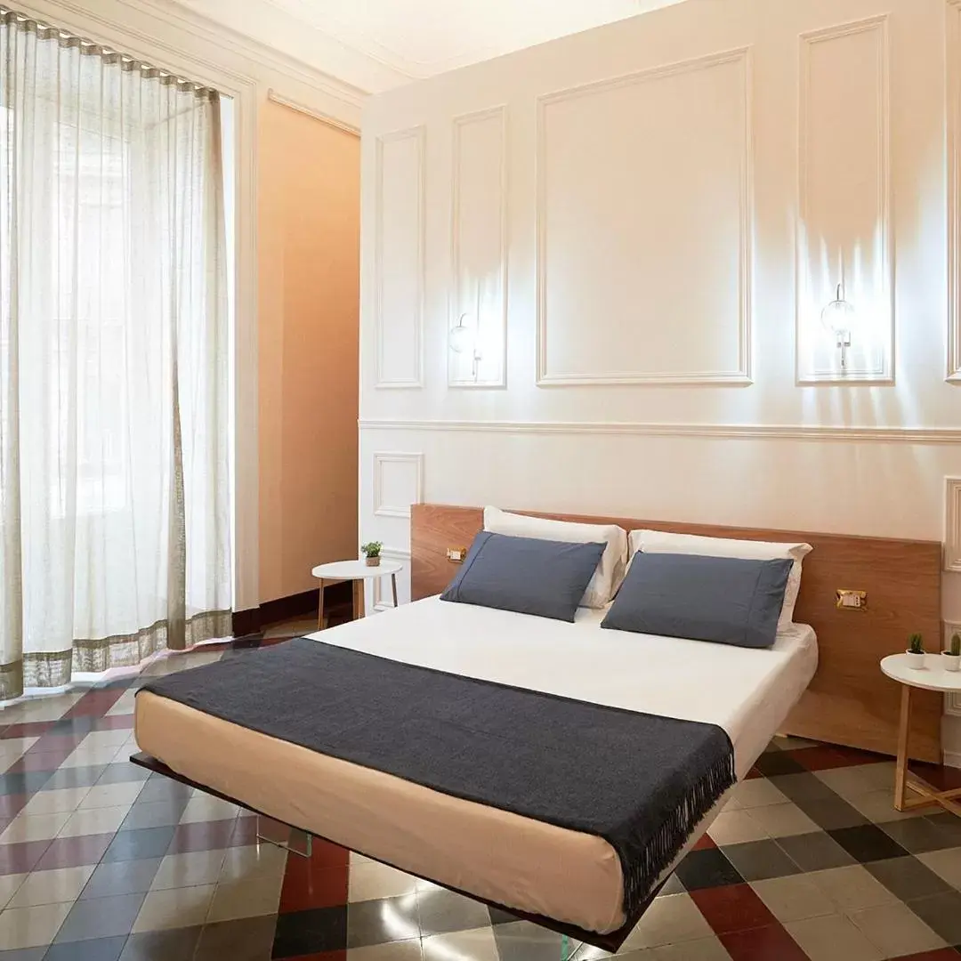 Bed in Toscano Palace Luxury Rooms Catania