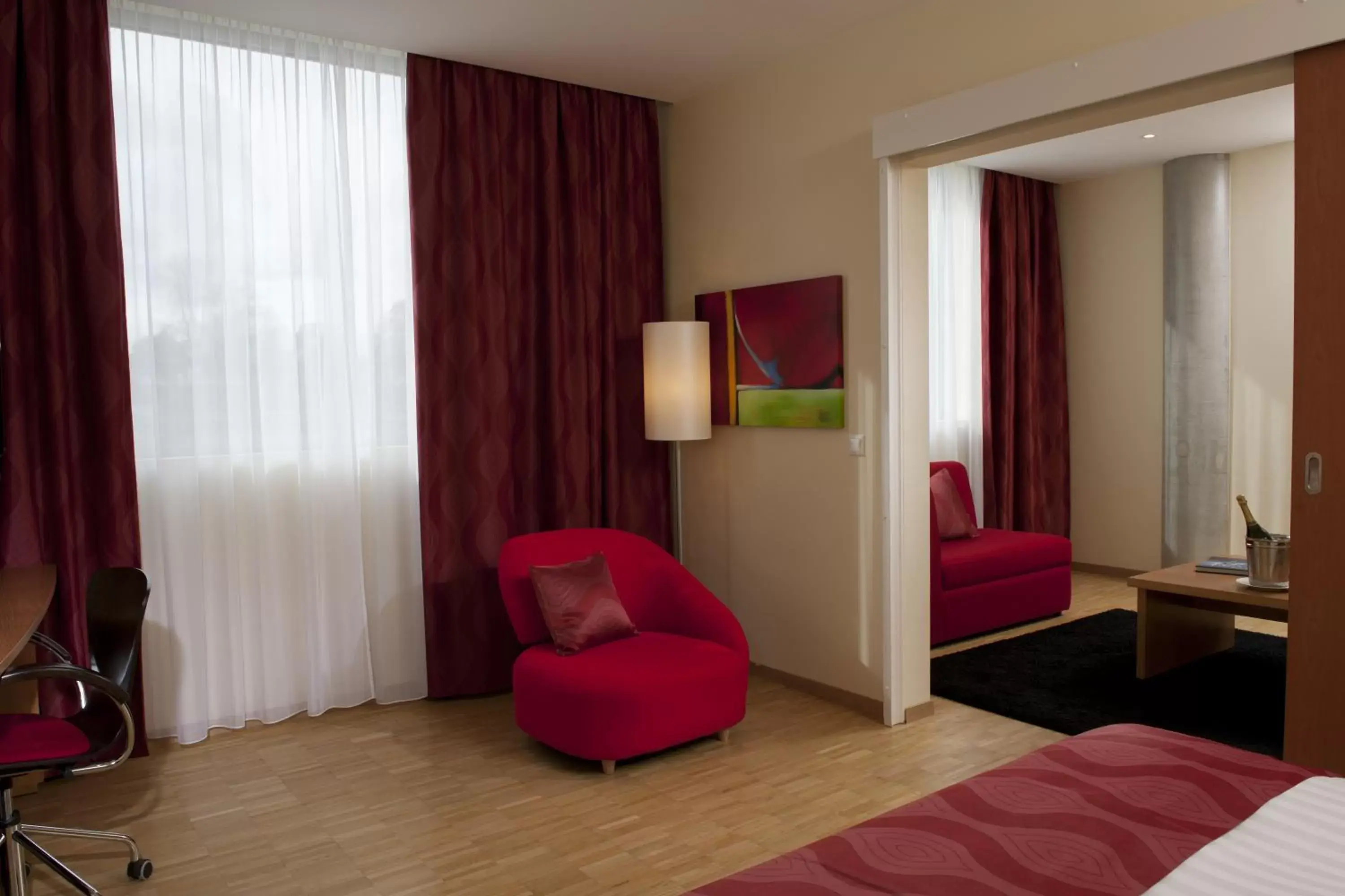 Bedroom, Seating Area in Ramada Encore by Wyndham Geneva