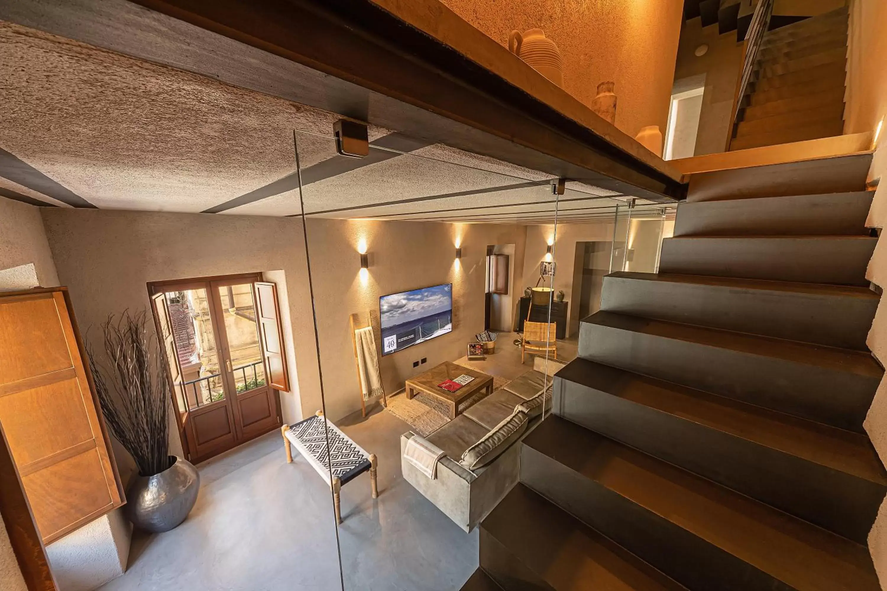 Communal lounge/ TV room in Casa Nostra Luxury Suites